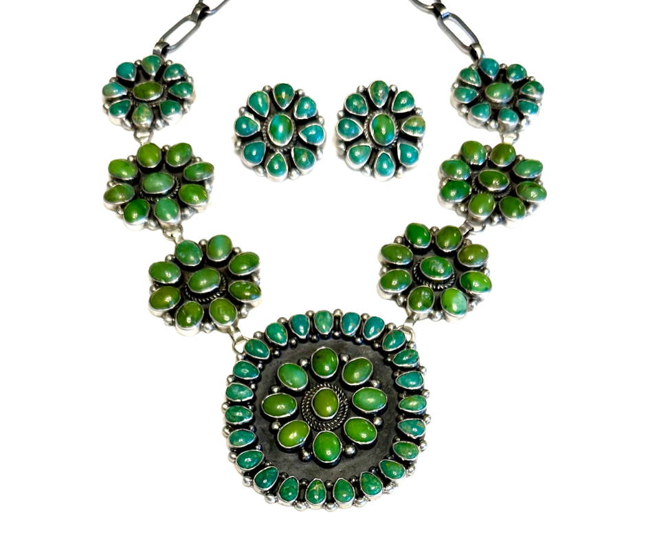 A vintage jewelry set consisting of a necklace and matching earrings with green and turquoise stones.
