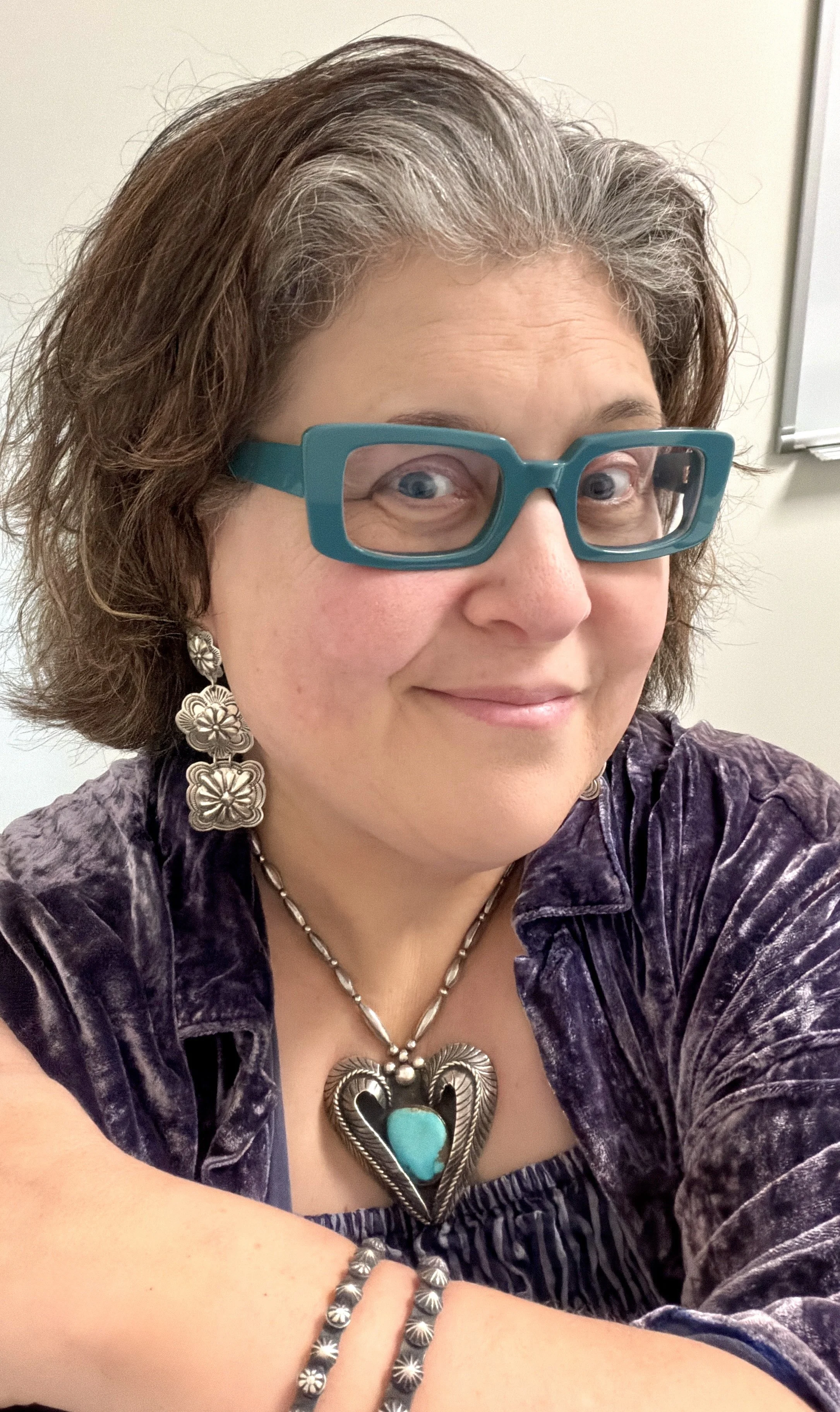 Wearing Genevieve Blackgoat earrings, Chimney Butte bangles, and vintage Navajo necklace