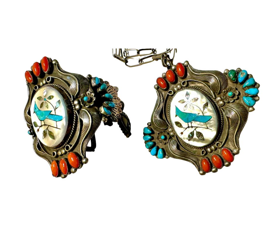 Vintage silver cufflinks with a blue bird motif, surrounded by orange and turquoise stones.
