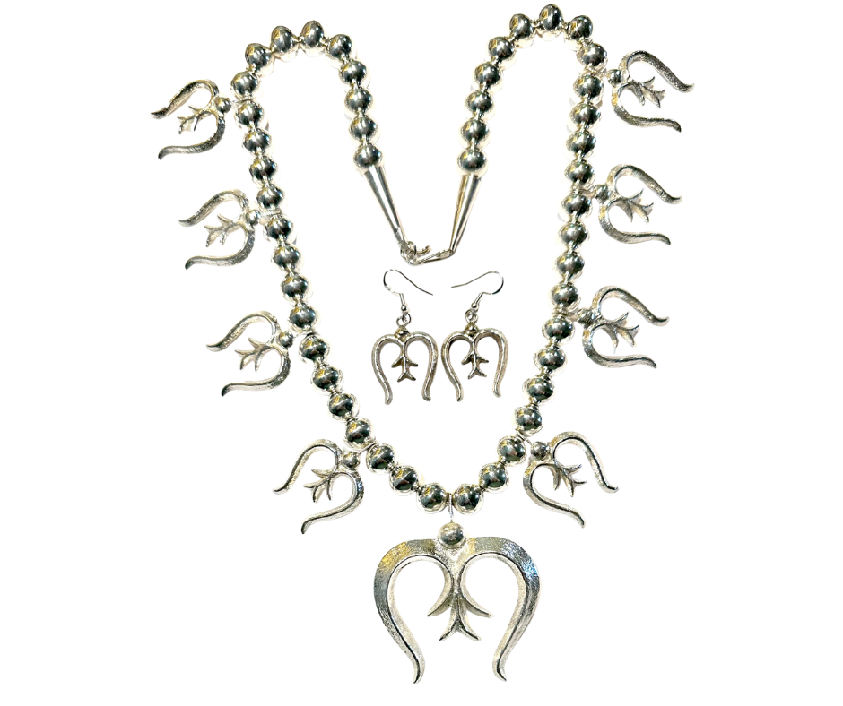 A silver necklace with a peace sign pendant and the numbers 2021, 2022, 2023, 2024, 2025, 2026, 2027, 2028, 2029, 2030, 2031, 2032, and 2033, each hanging from different parts of the necklace.