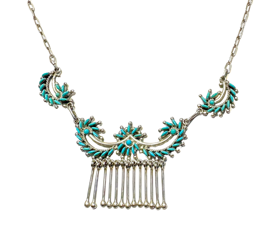 A silver necklace with turquoise-colored stone embellishments and dangling silver bars.