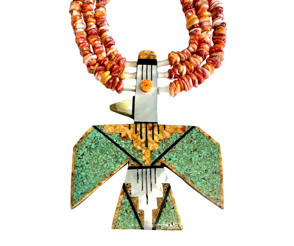 A necklace made of reddish-brown beads, with a pendant resembling a stylized abstract human figure, featuring green and orange mosaic patterns, and a black and white striped element at the top.
