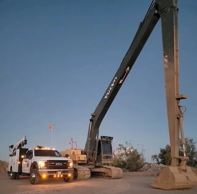 Service Truck- F550 pictured next to the Excavator