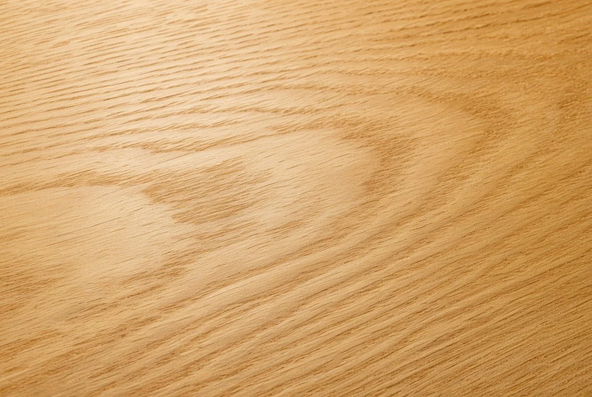 Close-up of Mindi wood (also known as Chinaberry or White Cedar). Clean, fine-to-medium grain with warm golden to honey tones and excellent dimensional stability — ideal for shelving and cabinetry.