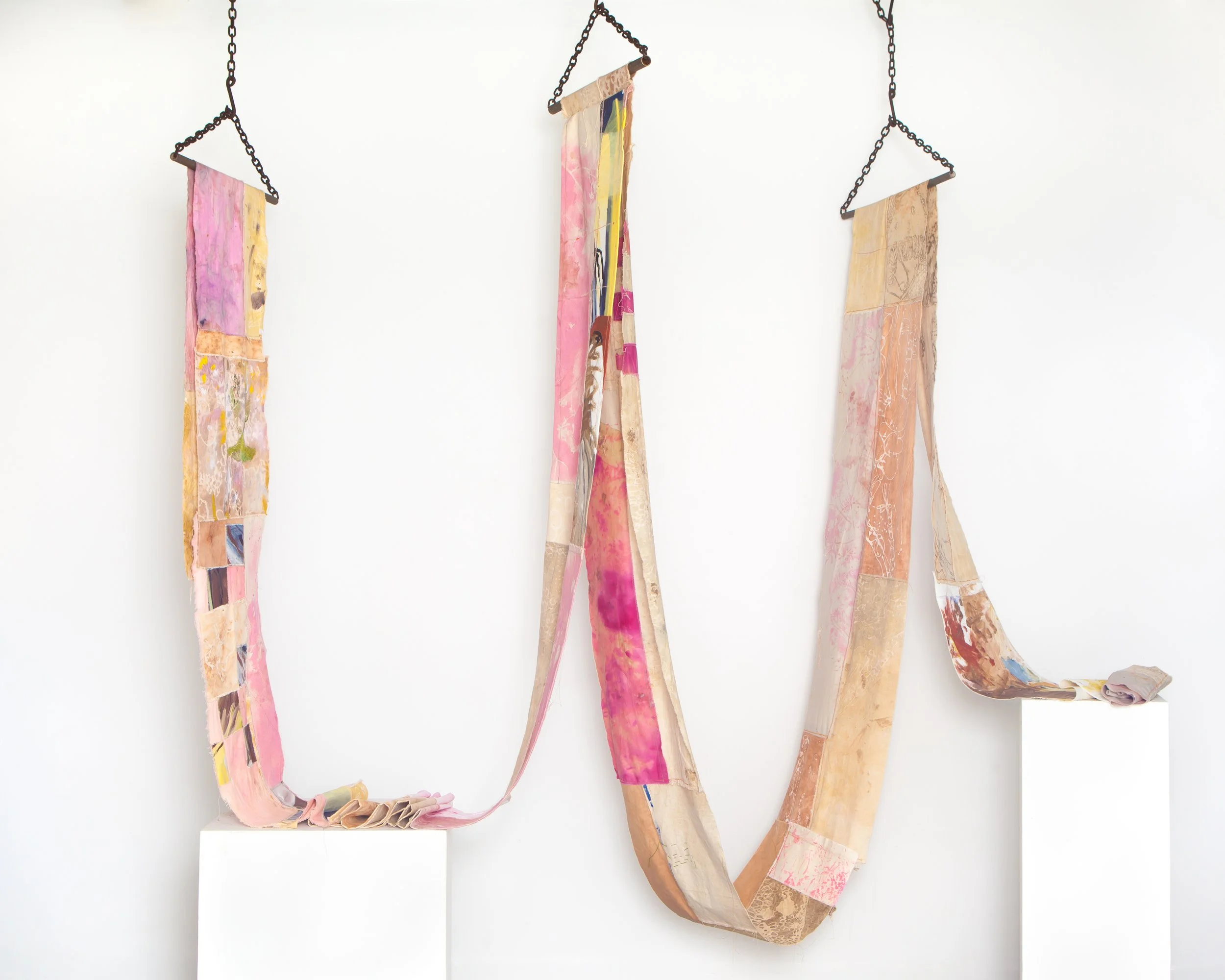 Matter reconsidered, discarded ground pigment paintings, studio waste, earth-stained cotton, botanical ink, spray dye, thread. Supported by found steel and chains, 40 x 15000cm, 2025