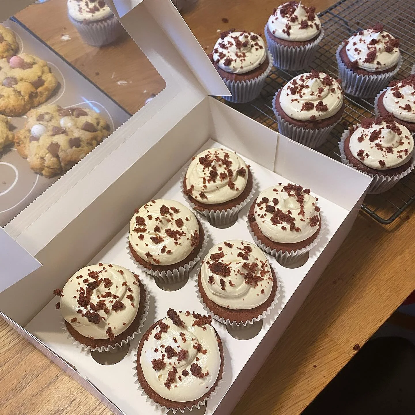 red velvet cupcakes and mini egg nyc cookies baked specially for my glossier sistas 🫶🏻🐣