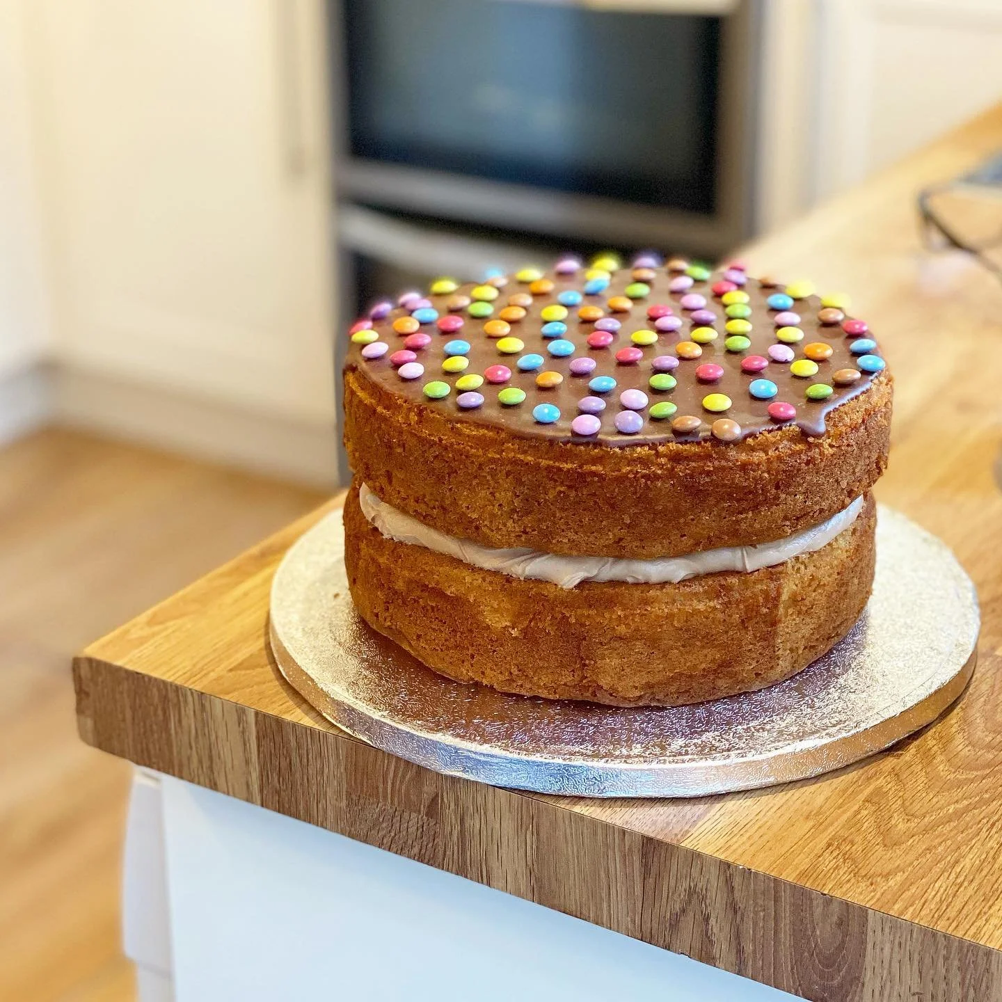 she is beauty, she is grace, she is a vanilla cake filled with Lindt chocolate buttercream and topped with smarties buttons very meticulously placed x

this cake is based on what my mum said she used to bake with her mum when she were a wee lil girl 