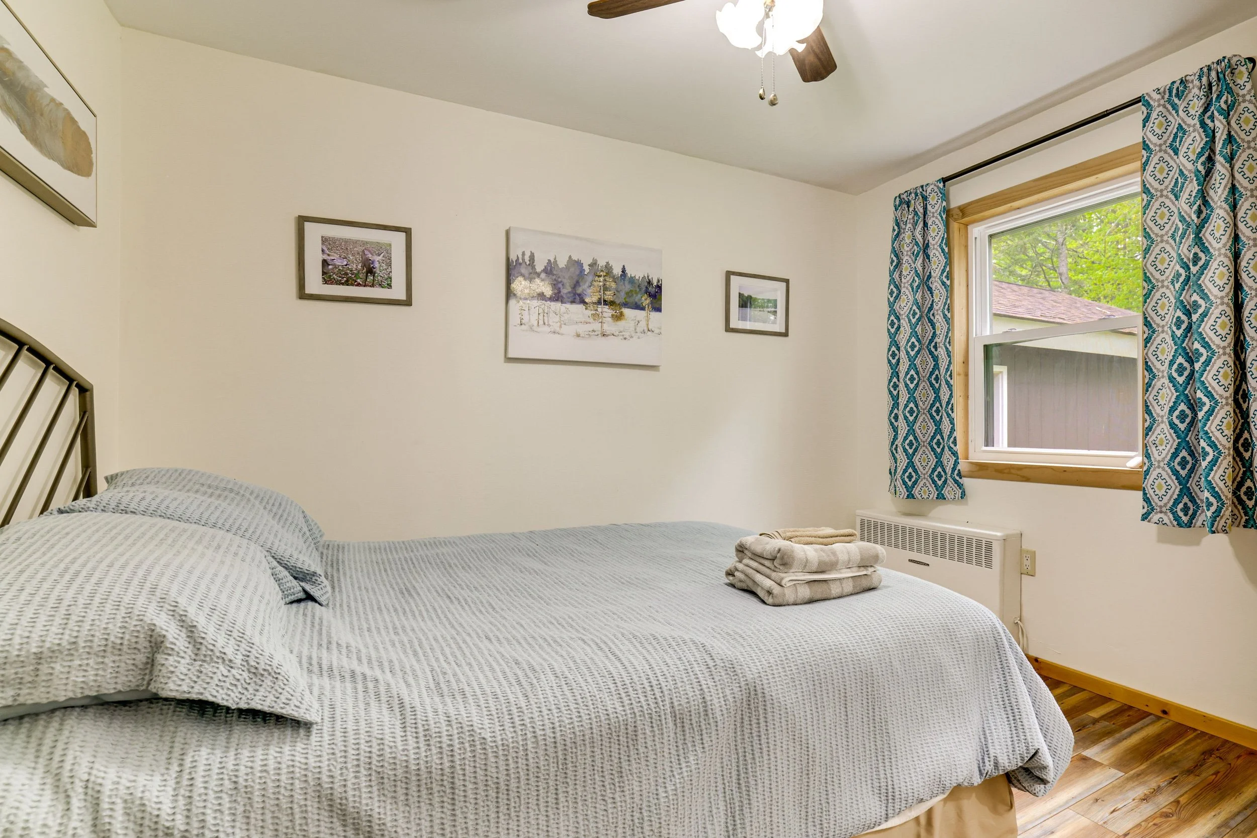 Second Queen bedroom facing lush side yard