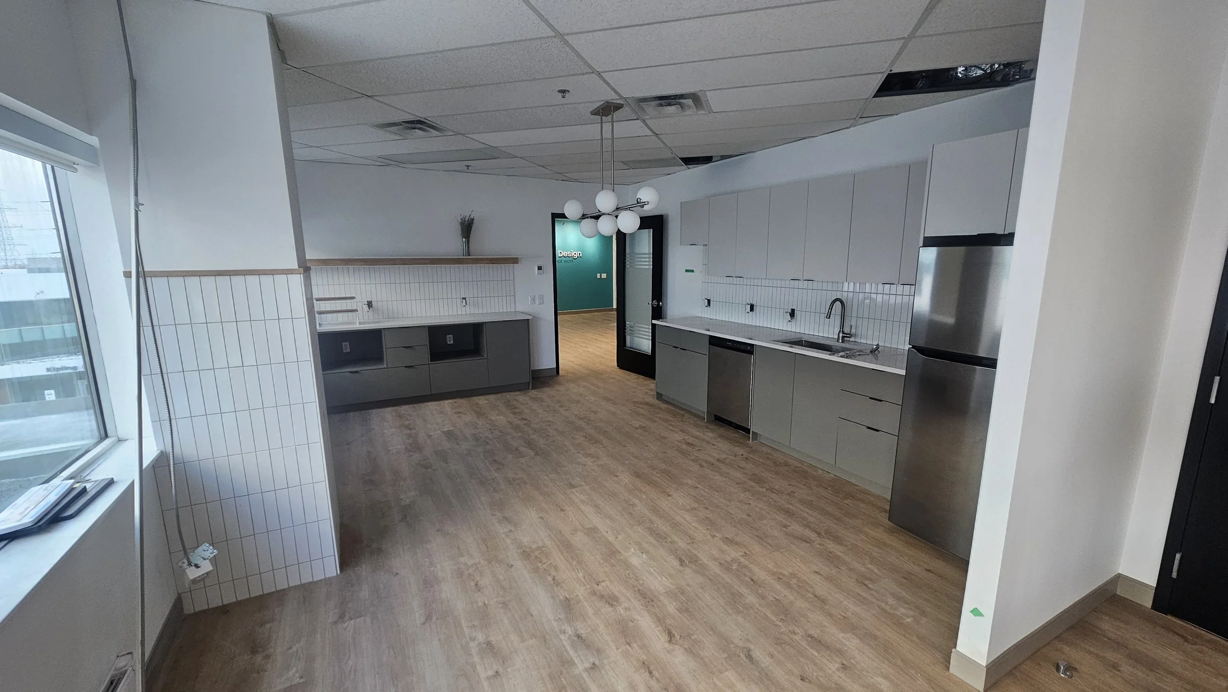 For this commercial office renovation, we installed a clean, minimalist white tile backsplash that brings a polished, professional look to the space. The simple yet modern design complements any office environment, creating a bright, welcoming atmosp