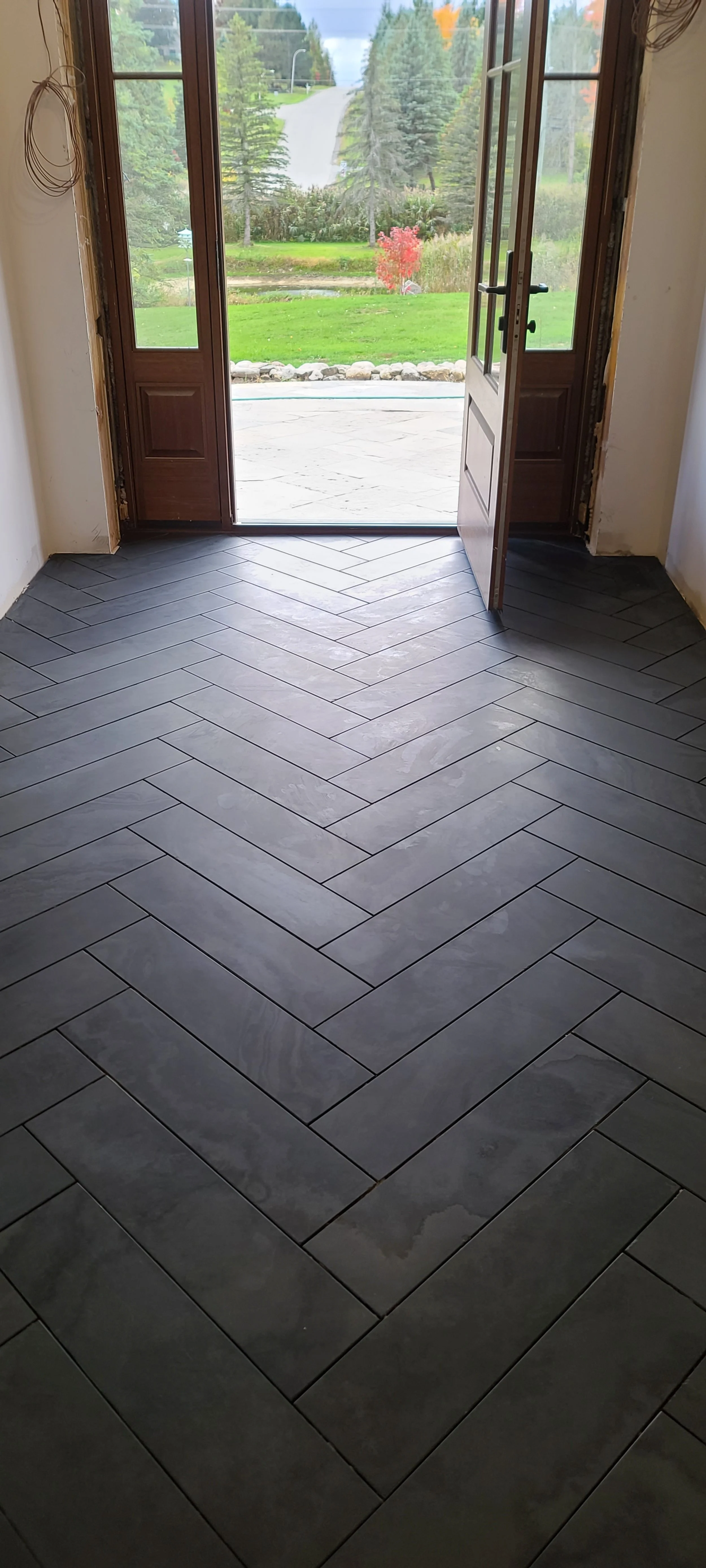 Herringbone Tile Floor Installation

A herringbone tile floor delivers timeless elegance with a bold, high-end look that instantly elevates any space. This classic pattern features rectangular tiles laid in a staggered “V” formation, creating depth, 
