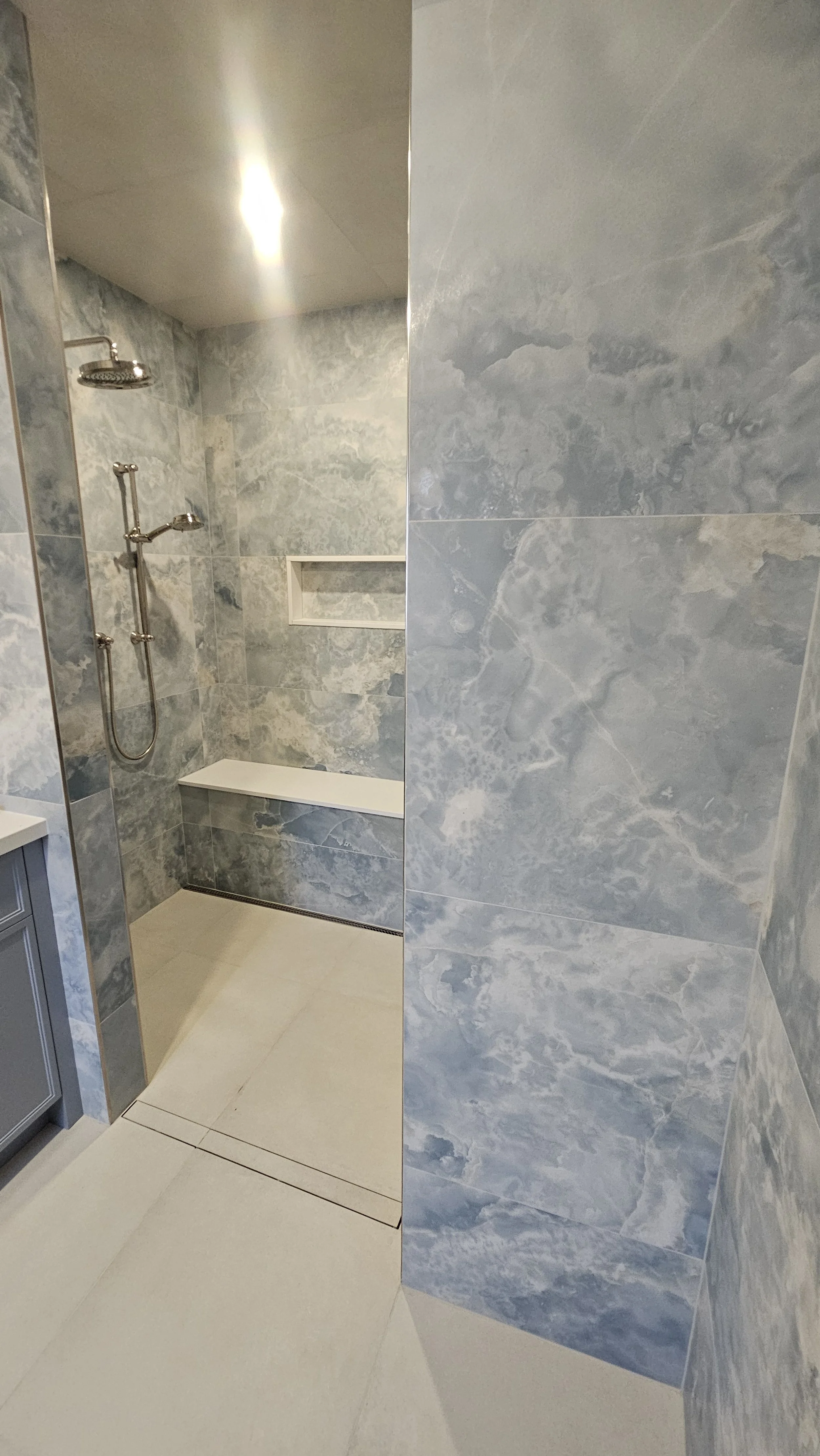 This walk-in curbless shower built in North York is designed for comfort, safety, and modern style, making it an ideal solution for wheelchair-accessible bathrooms and aging-in-place renovations. The barrier-free entry creates a smooth, open transiti