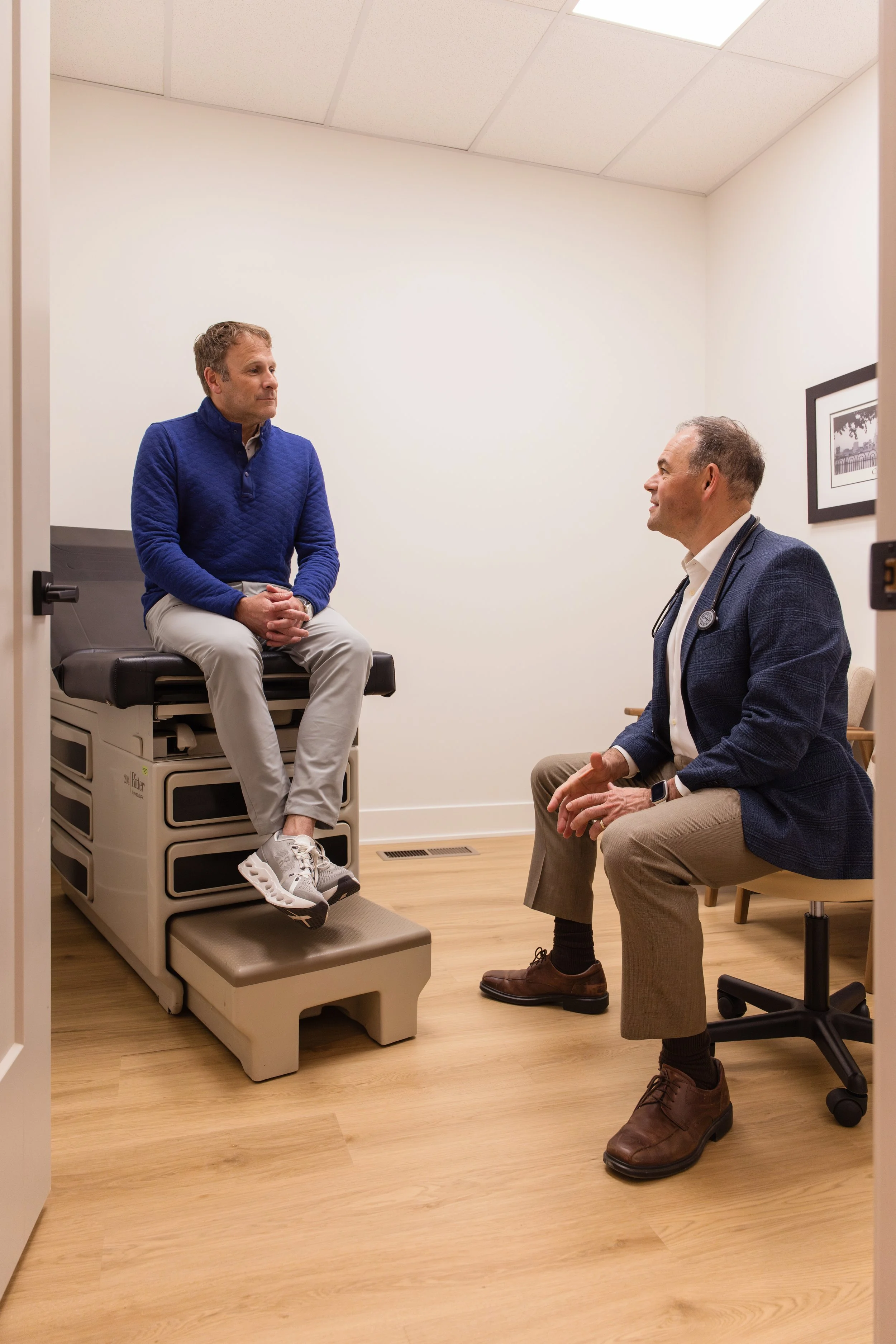 Dr. David DeMarco, MD, consulting with a patient at DexaFit Cincinnati