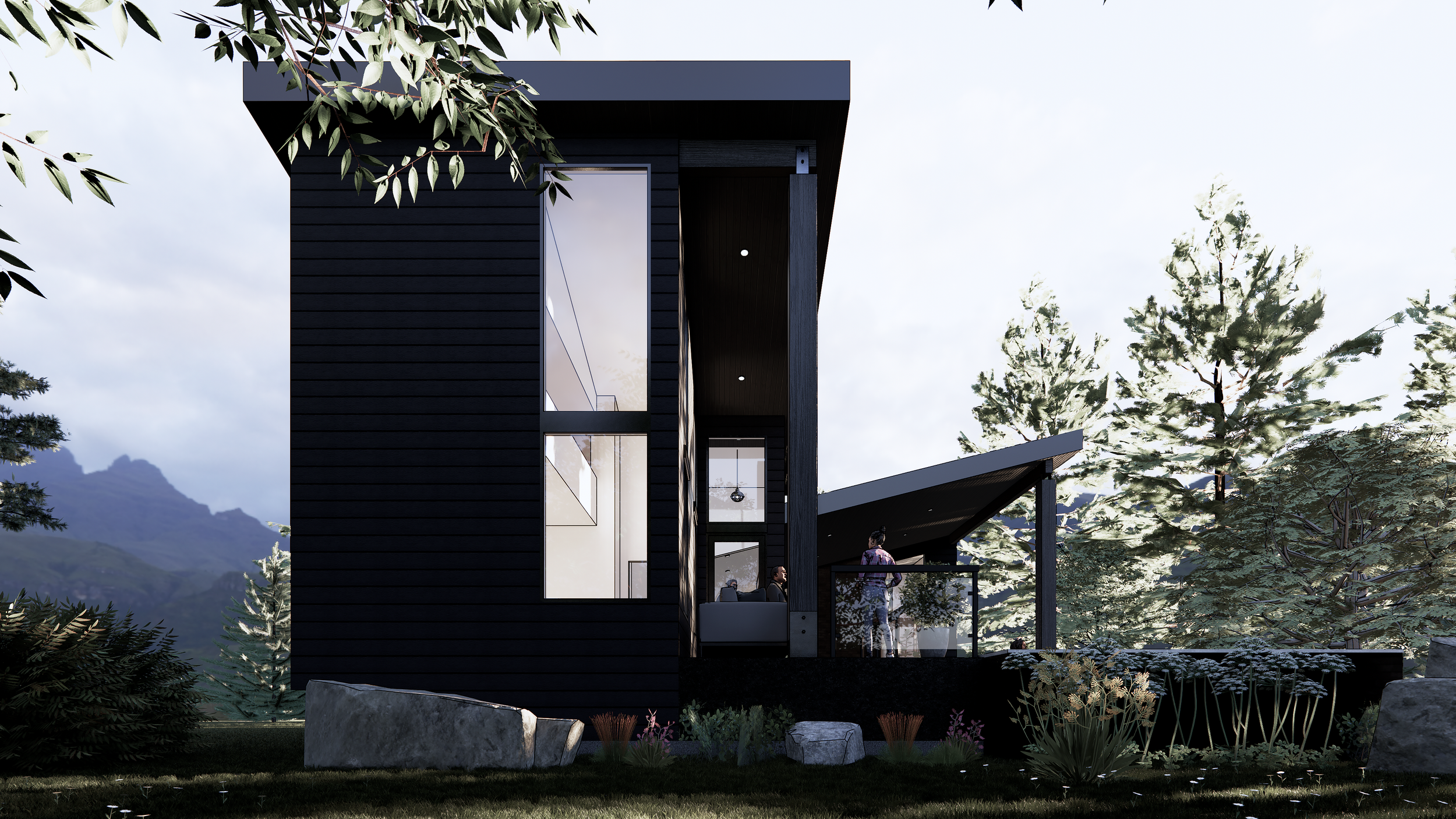 A modern mountain cottage with black exterior walls and large glass windows, surrounded by trees and mountains, with a person standing on the balcony and another inside looking out.