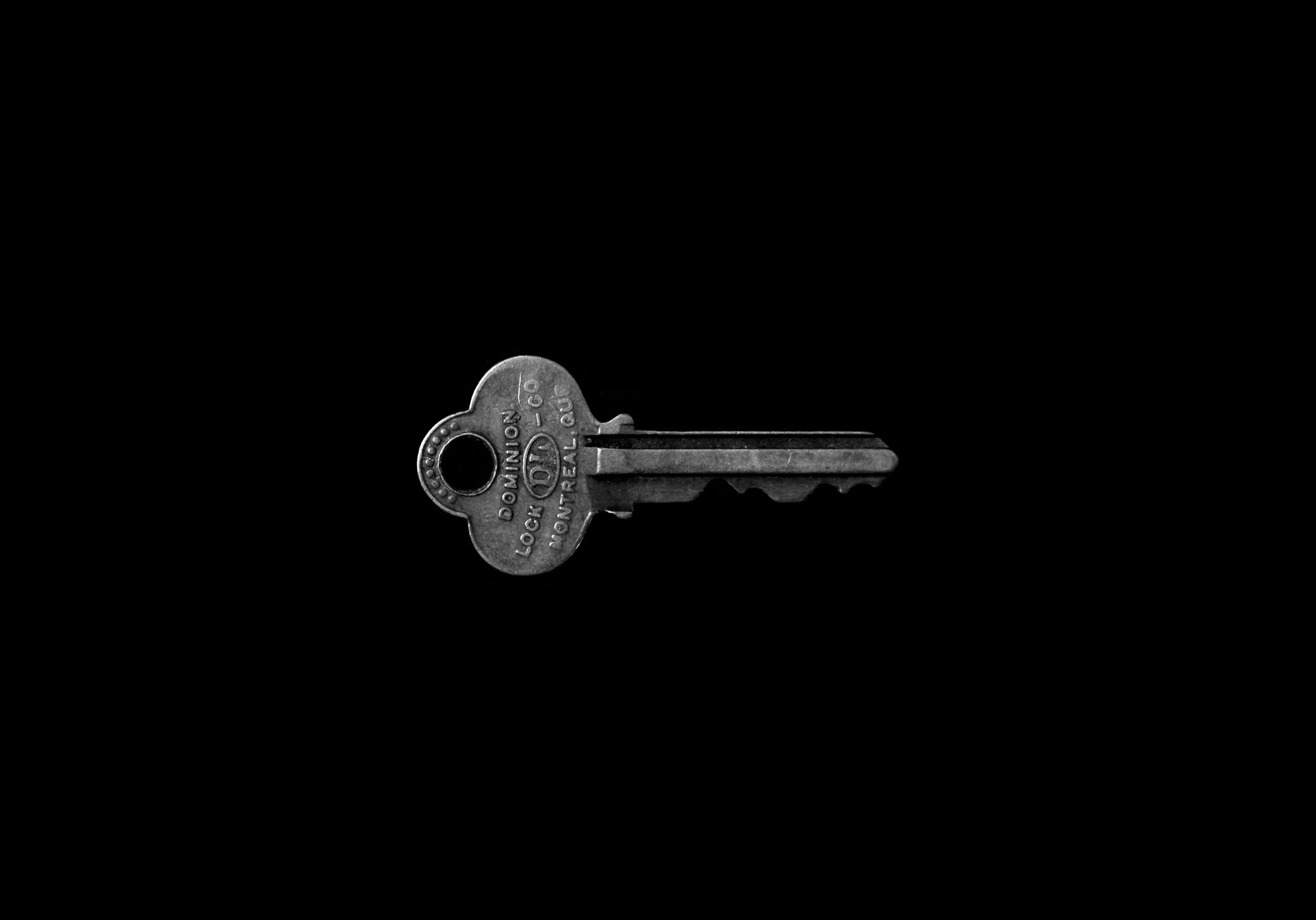 Single silver key with black background, labeled 'Lock (MILON) 60' and 'Montreal QC'.