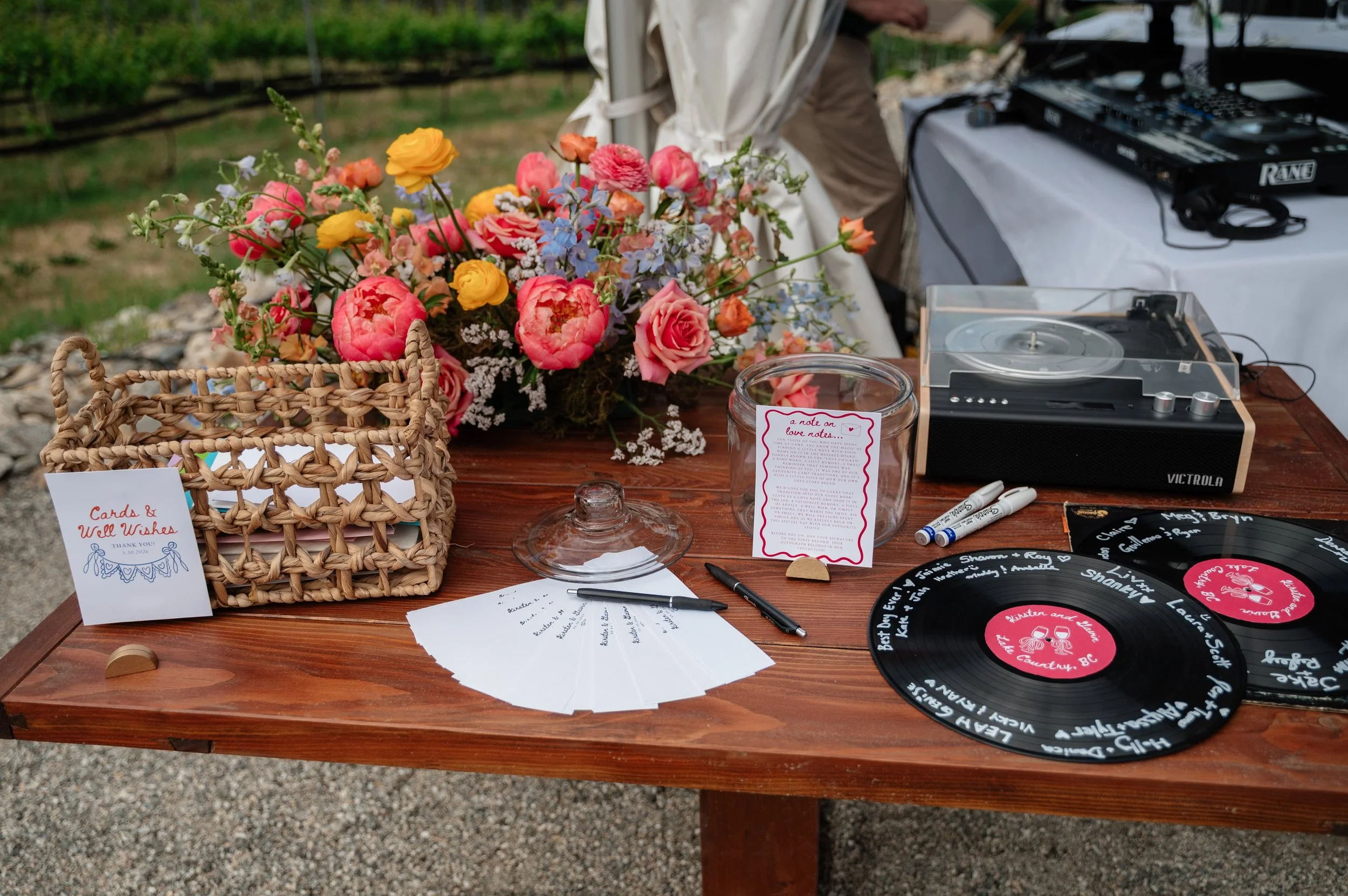 Guests sign vinyl records as a personal guest book
