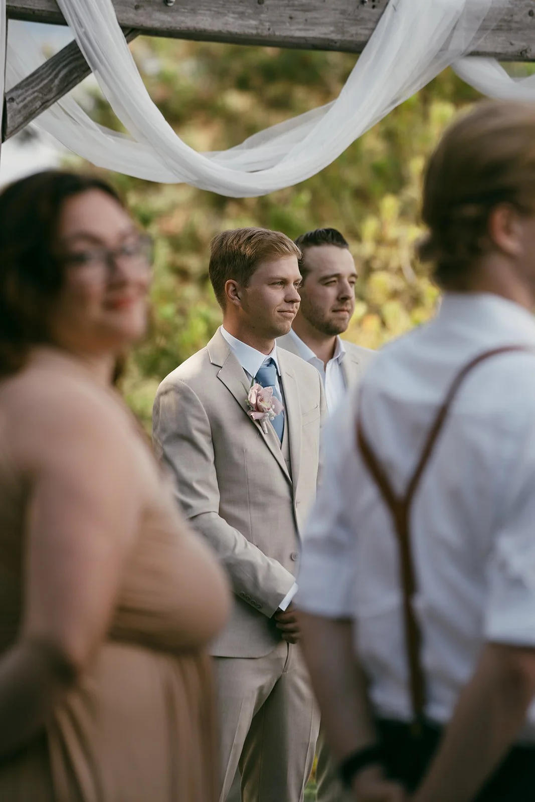 Freddie waiting for Grace to come down the aisle