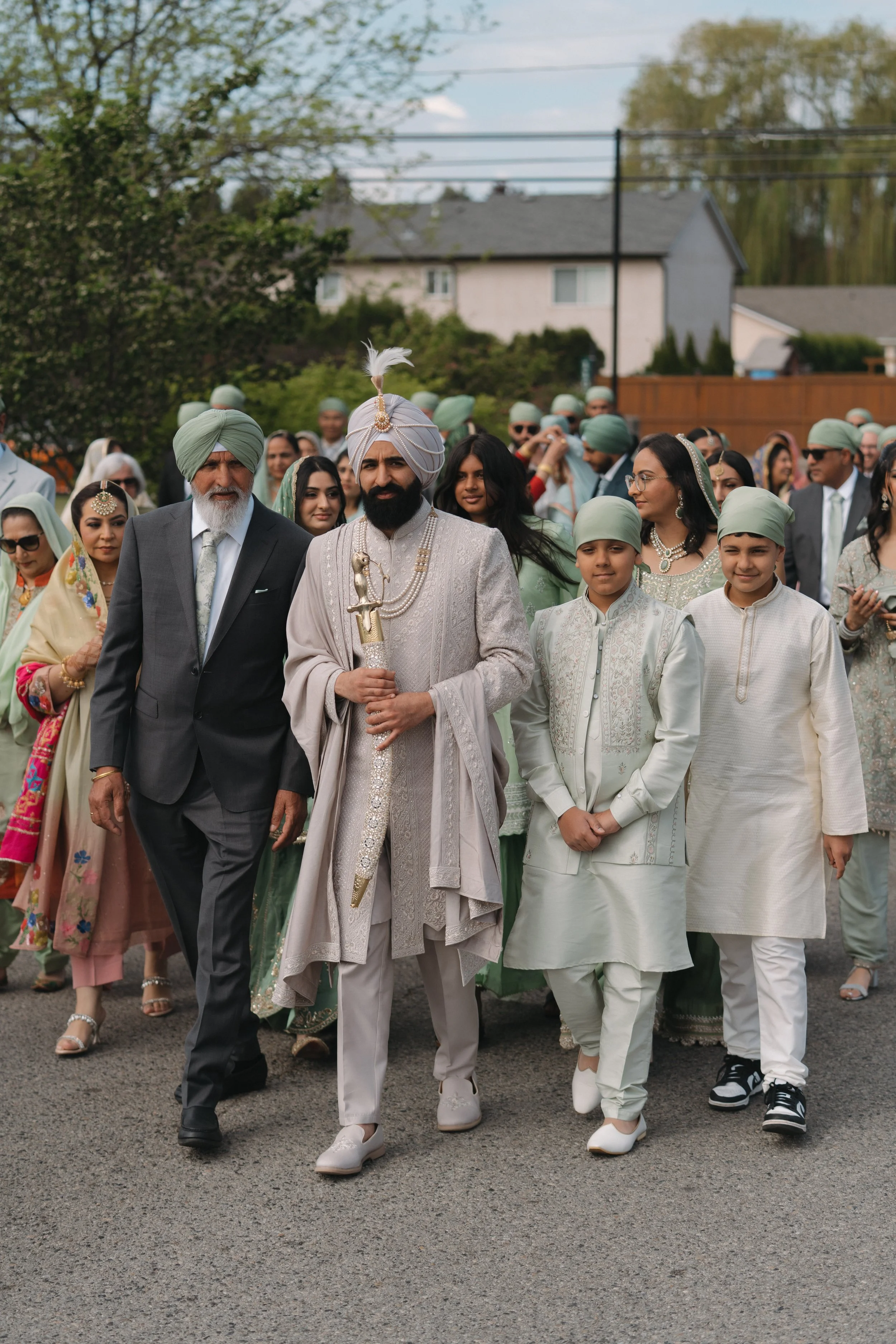 Nov walking toward Okanagan Sikh Temple with his family