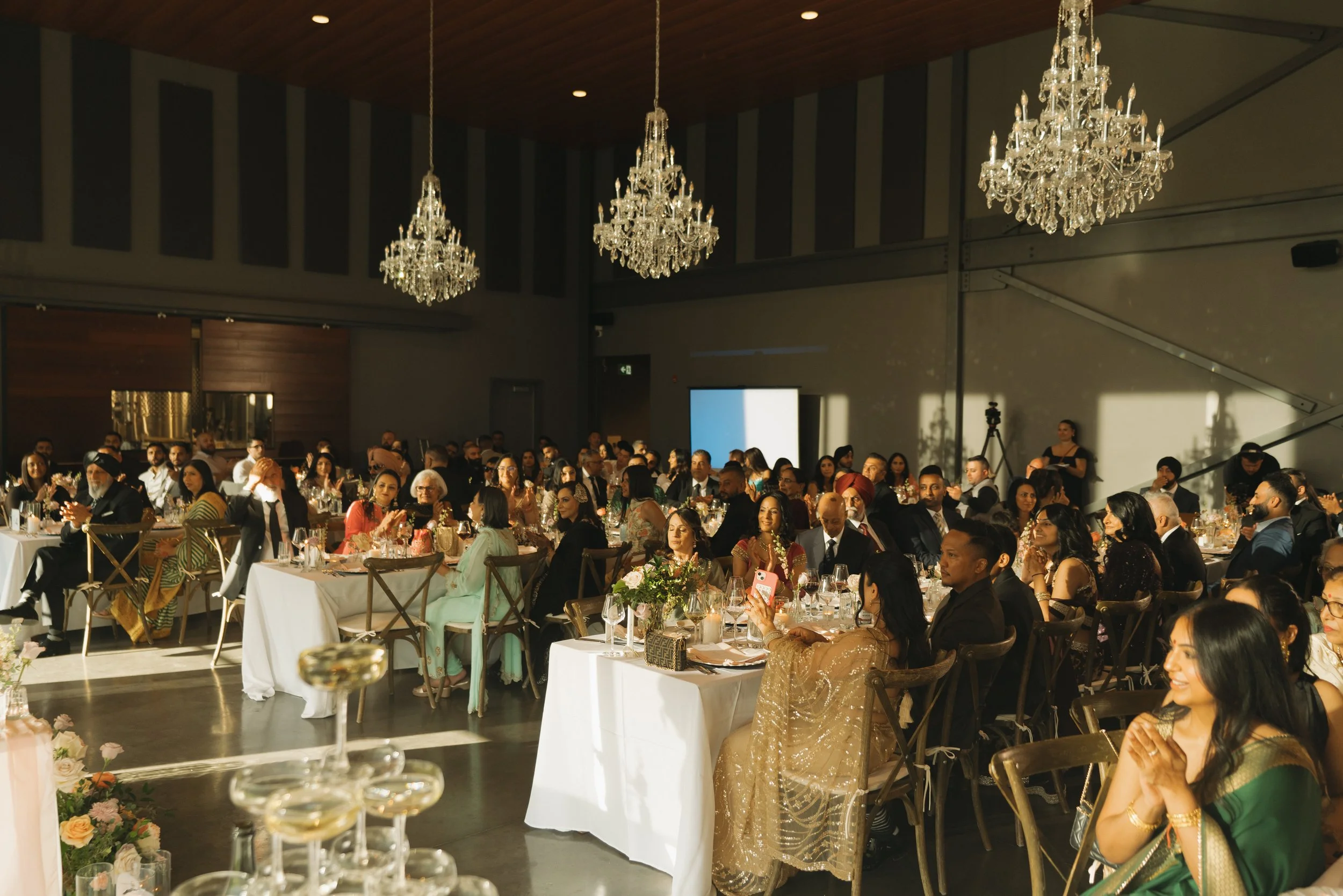 Wedding guests celebrating at a Lake Country winery wedding