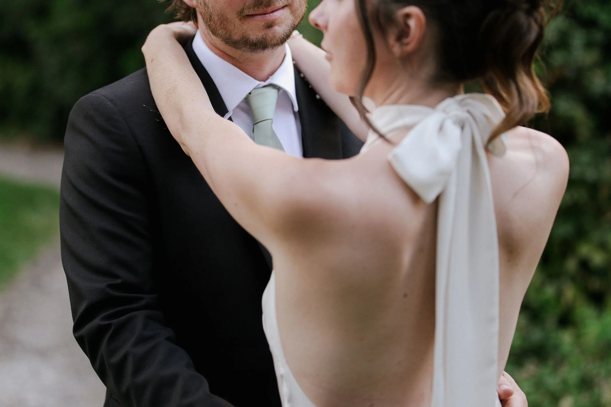 A candid moment between Cat & Cam on their wedding day 