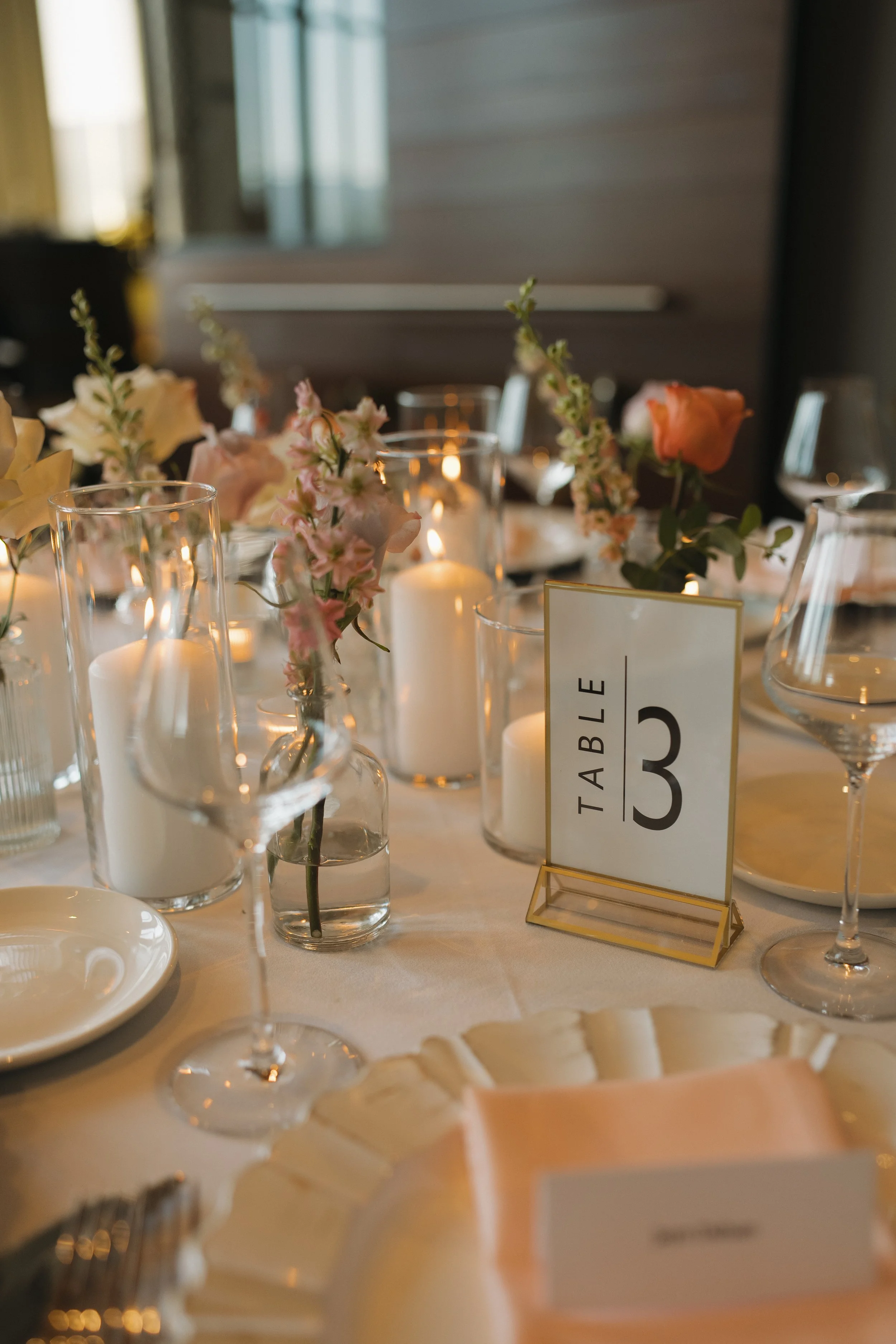 Wedding tables prepared for the reception at 50th Parallel Estate Winery
