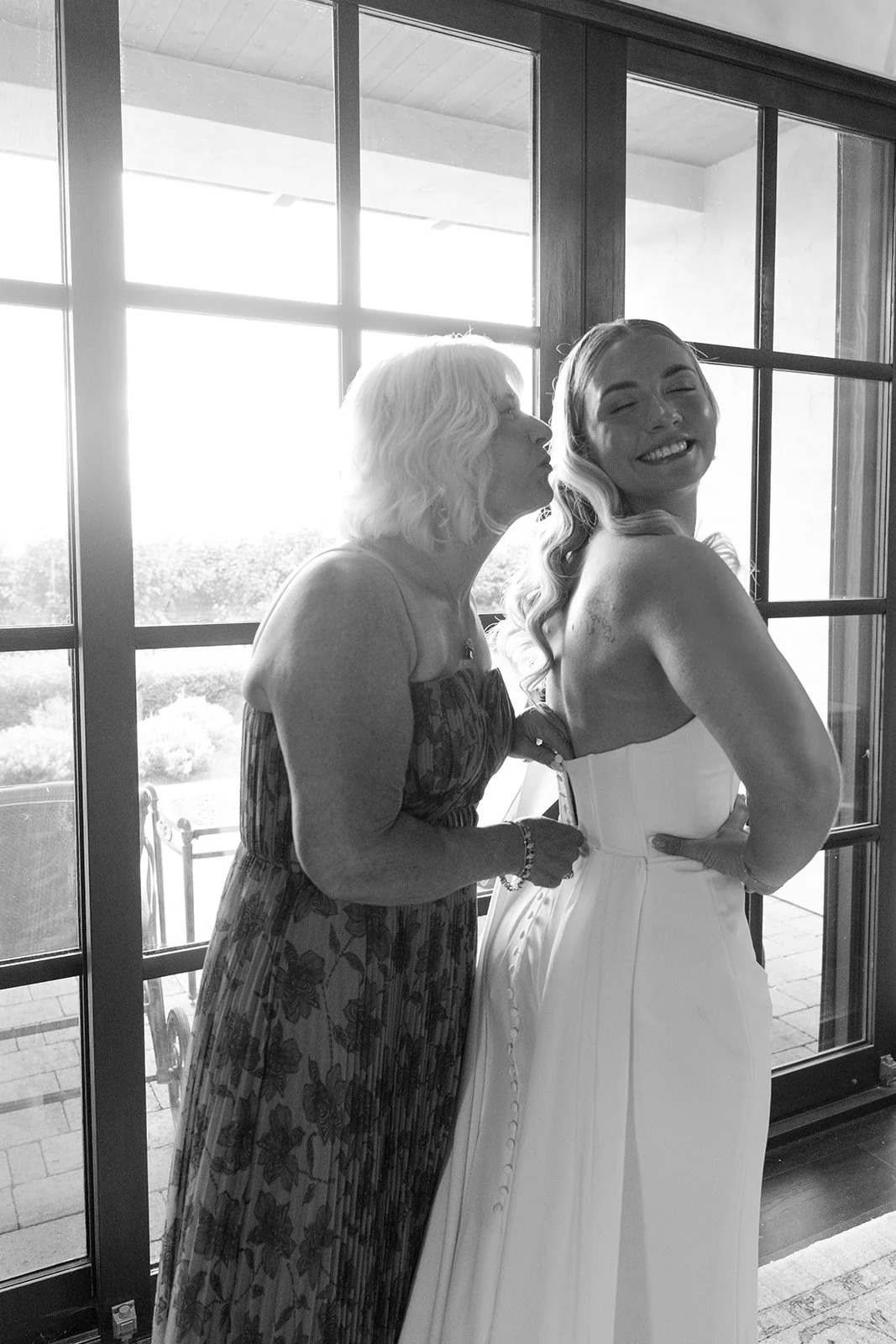 Bride sharing a quiet moment with her mother before the ceremony