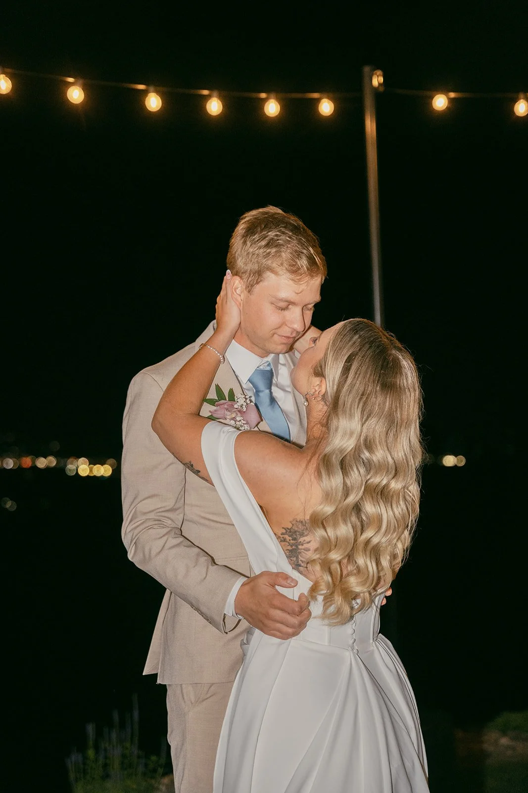Grace & Freddie enjoying their first dance under string lights