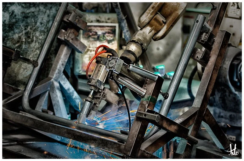 Robot welding machine welding centre post sockets.