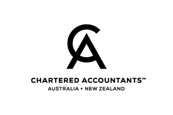 Woman sitting on steps in front of a house holding a camera