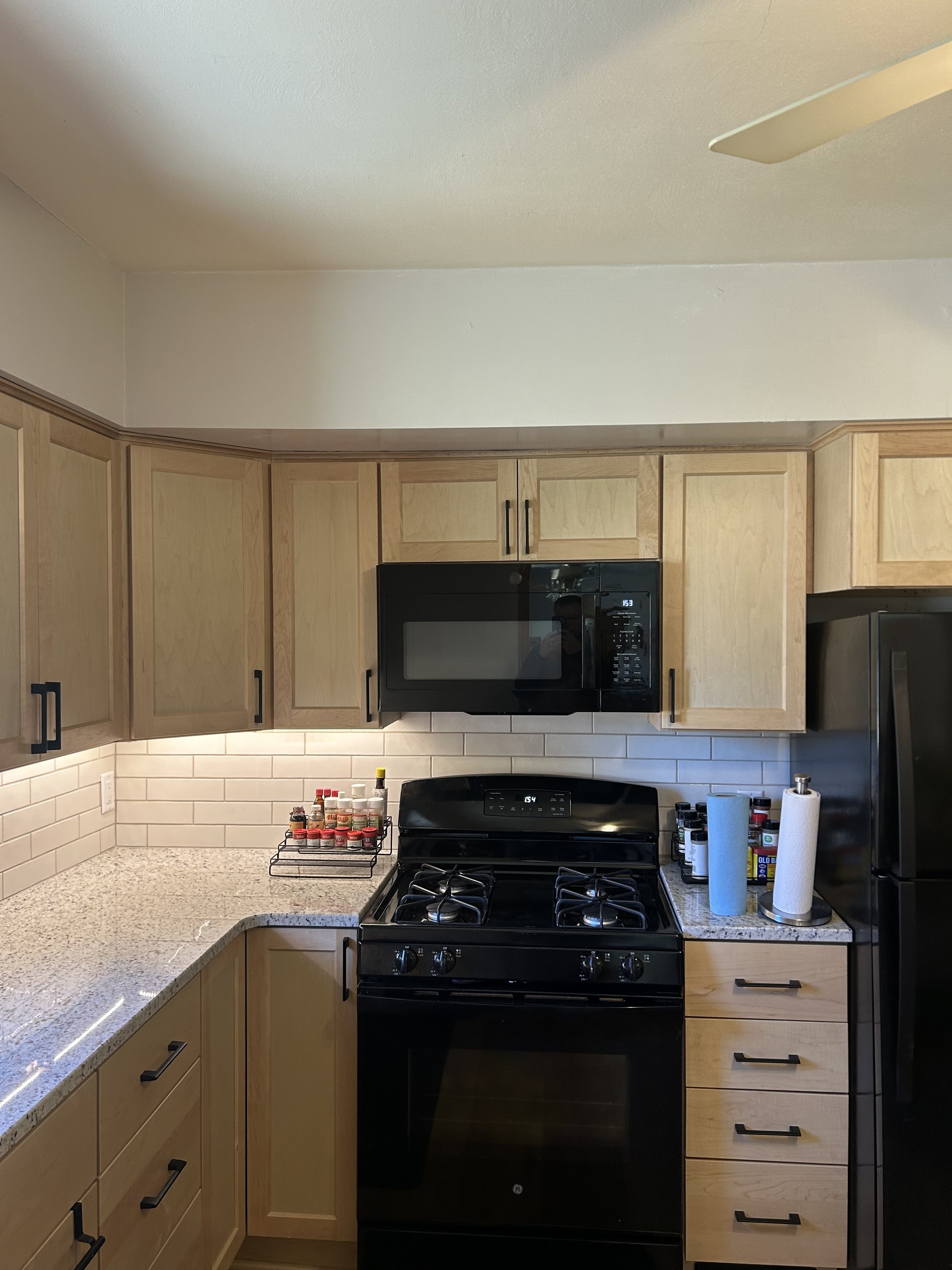 Beautiful maple cabinets with the subway tile backsplash welcomes this kitchen into the 21st century.