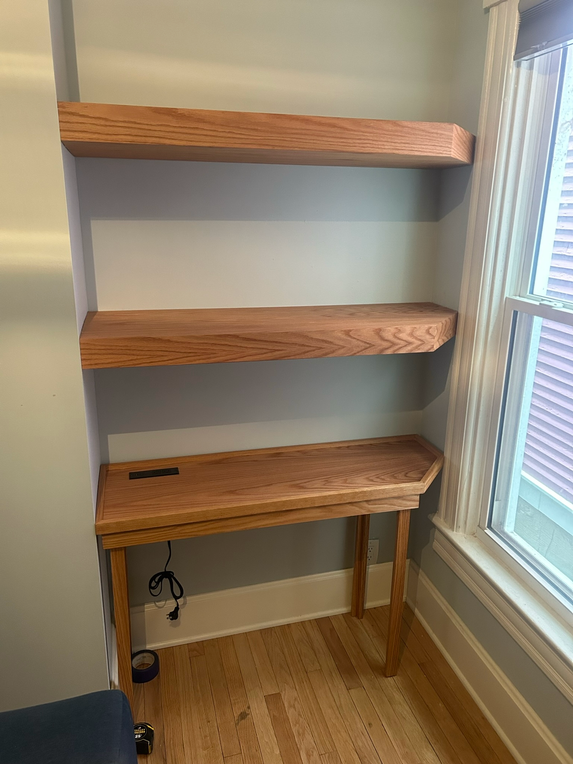 Floating red oak shelves with behind-the-couch table.