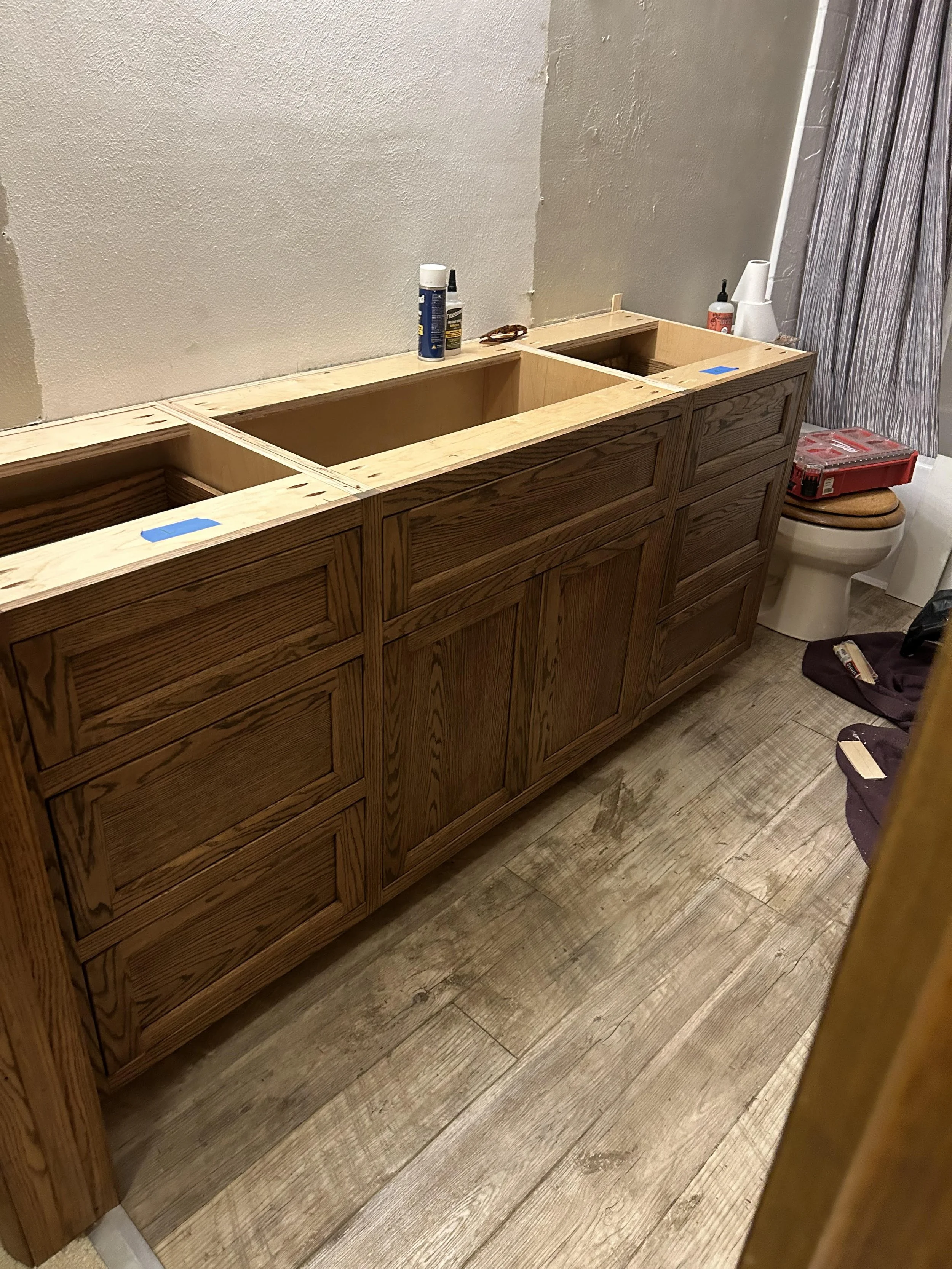 Customers wanted a large vanity that would match the rest of the millwork in their bathroom. Solid red oak.