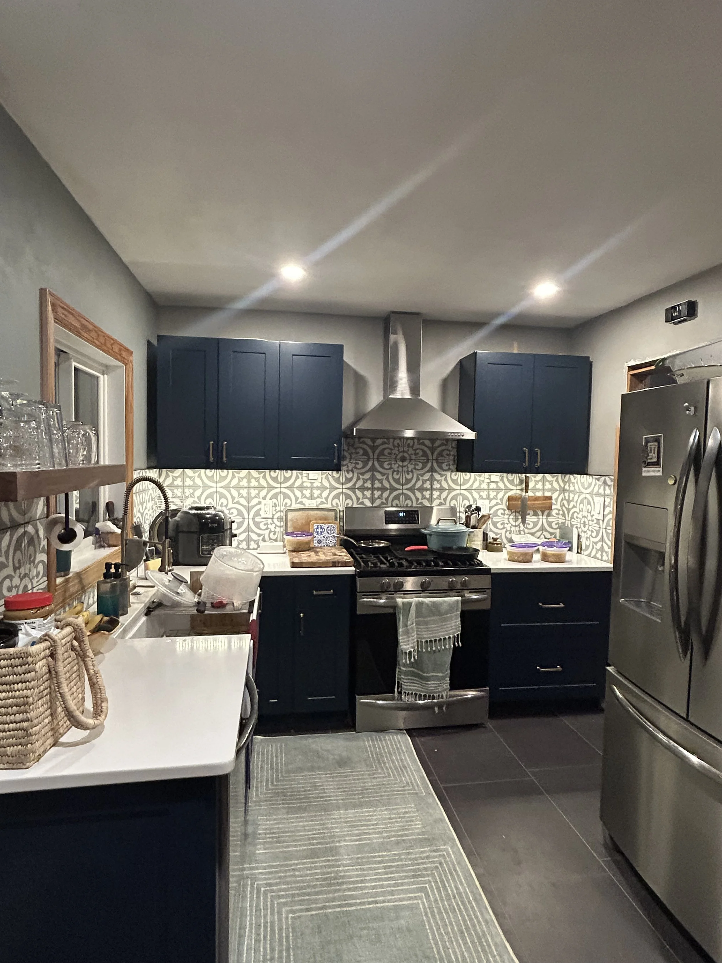 This kitchen previously lacked countertop space and was very outdated. We removed a wall and tripled the countertop space. We gave it a modern feel with the tile backsplash.