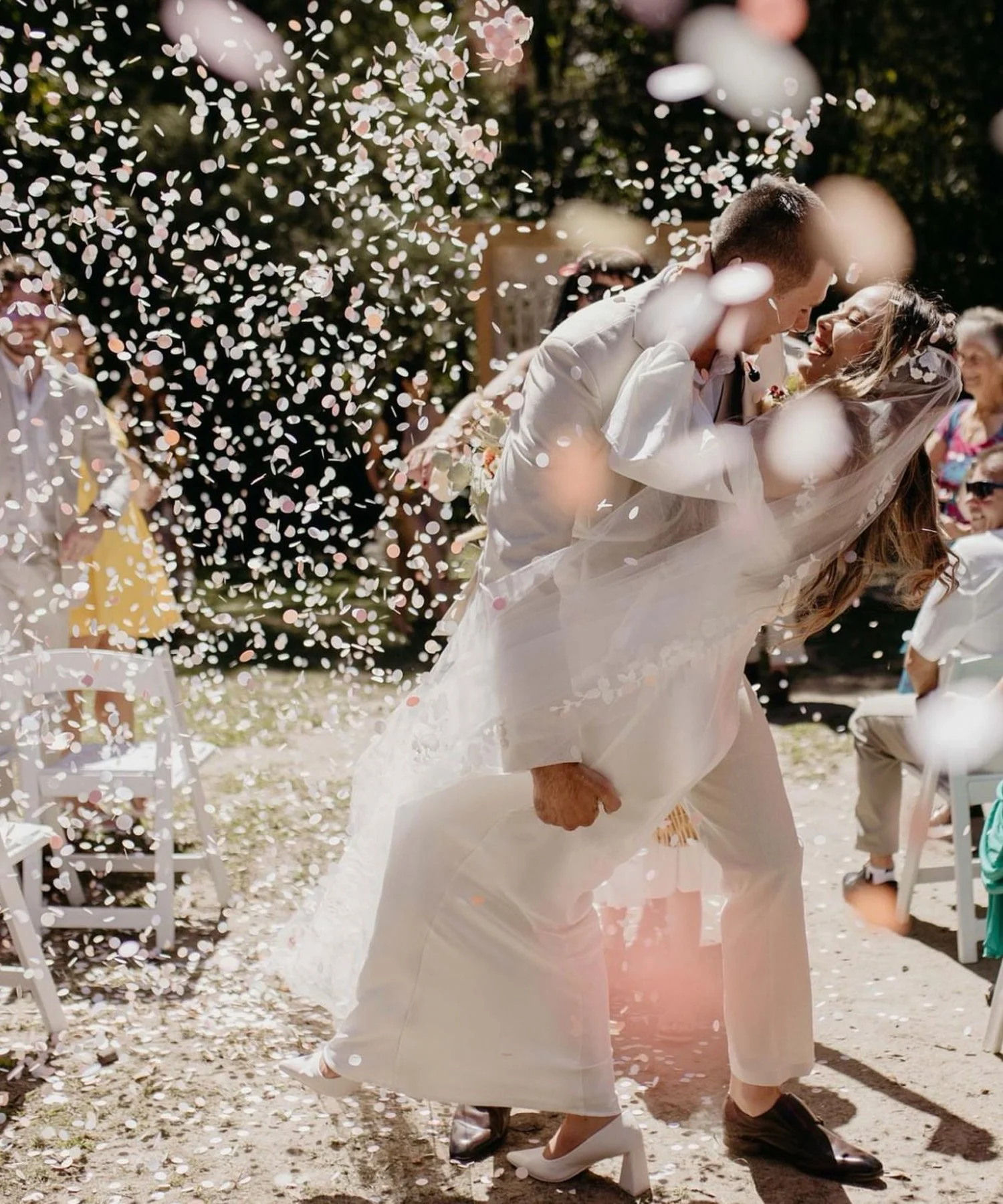 Bride and groom in the isle embracing on their wedding day