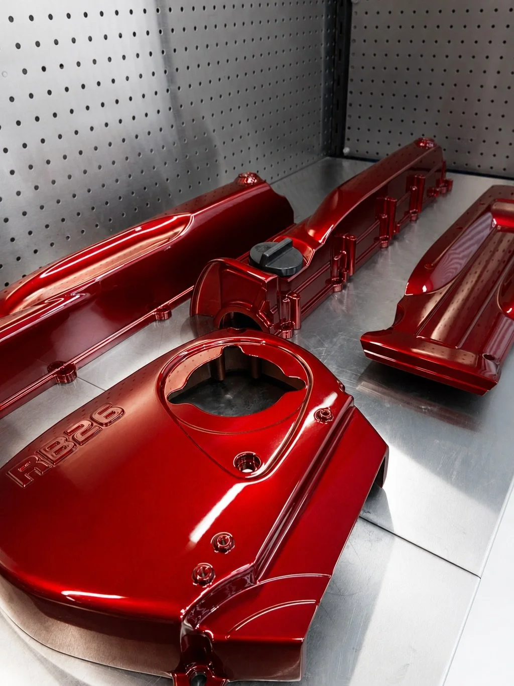 One of our most popular colours, Candy Red, finished on a set of RB26 rocker covers. Dark and rich in the shade, but once the sun hits it, the colour comes alive.

Swipe to the last slide to see them in the sun ☀️

#RB26 #GTR #CustomPaint #EngineBayG