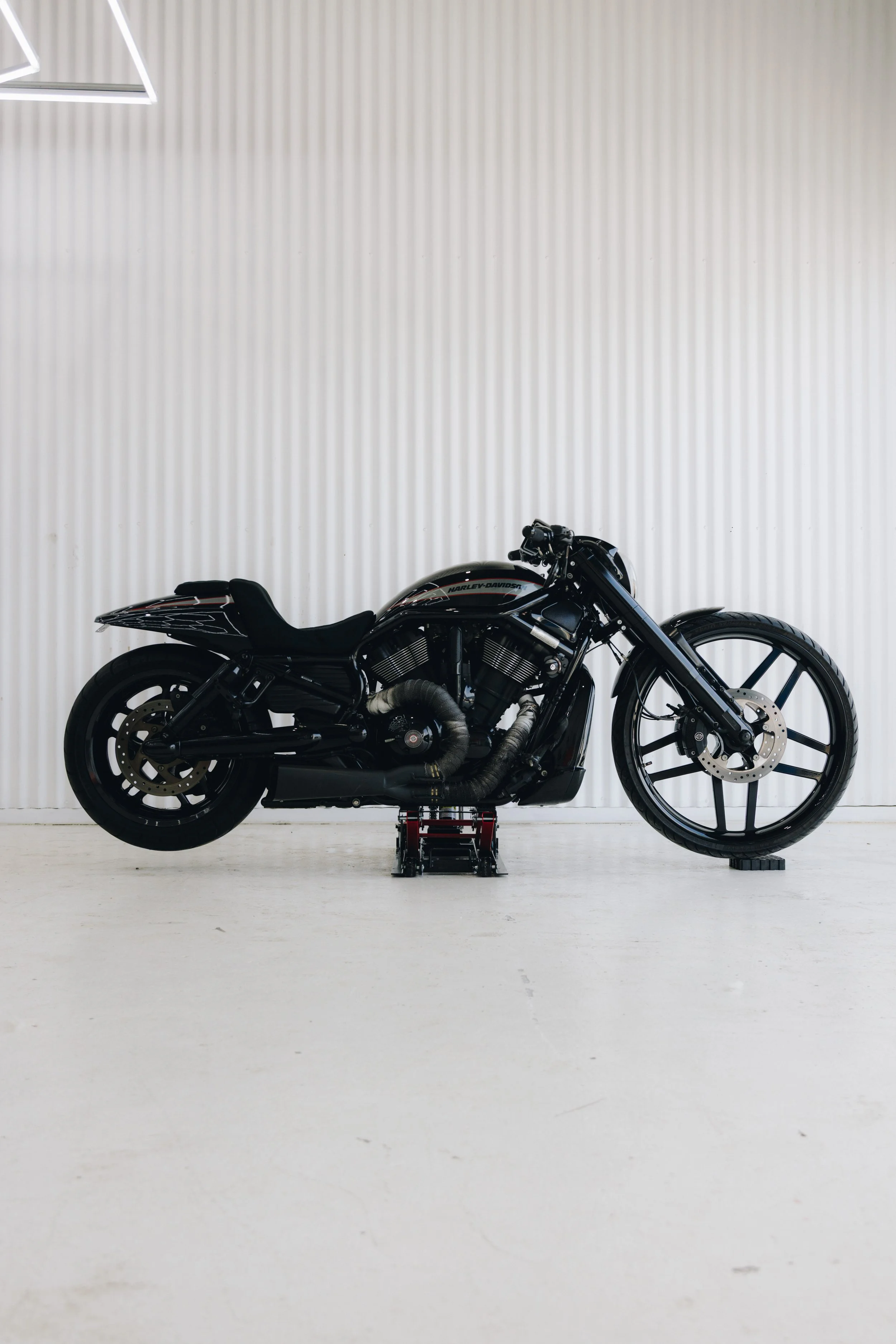 Custom motorcycle paint work with hand-finished flame design completed by Koguma Garage, offering bespoke motorbike paint, custom graphics, and high-quality refinishing.