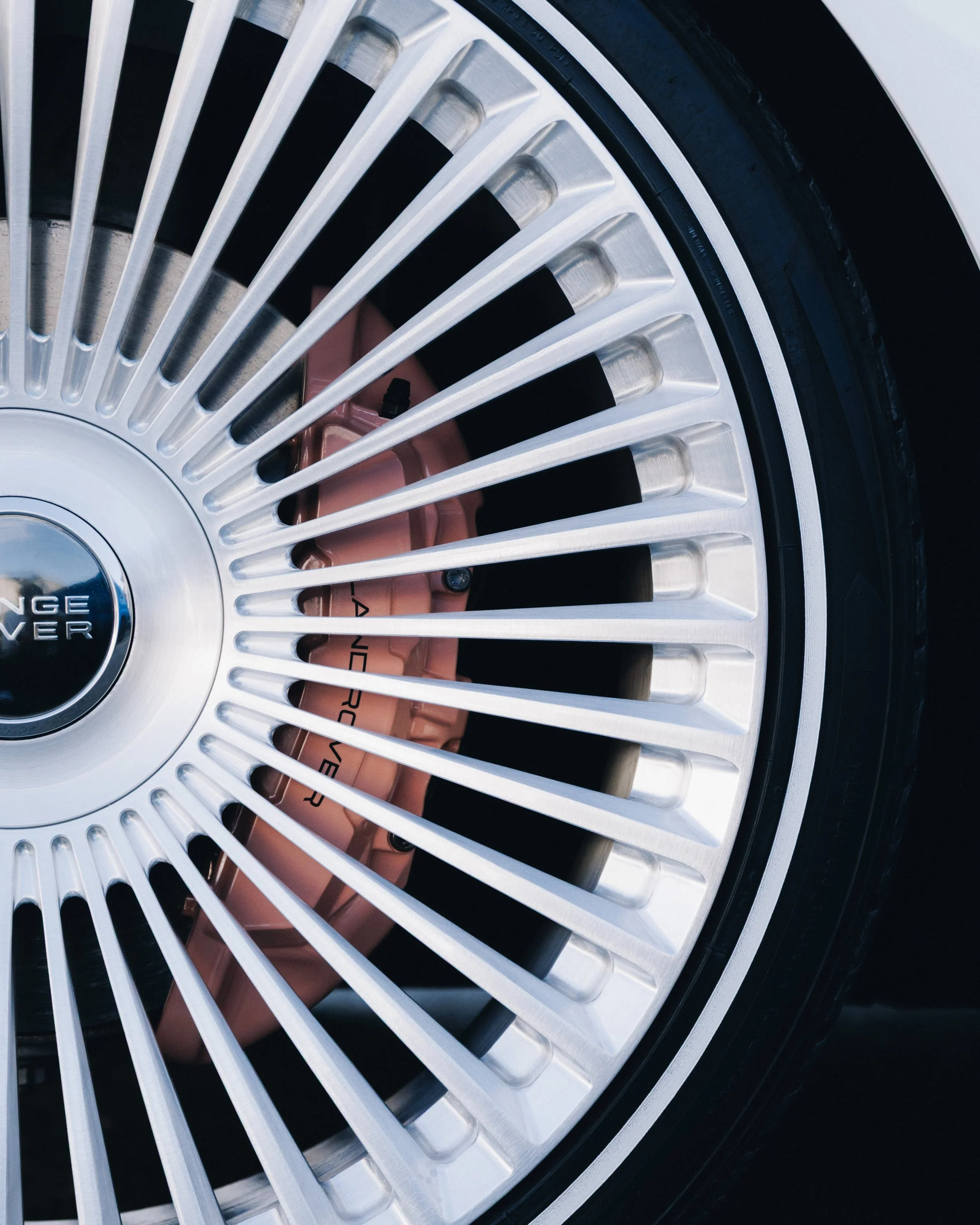 Performance brake upgrade with red calipers and drilled brake discs installed at Koguma Garage, offering custom brake refinishing, performance upgrades, and precision workshop fitment.