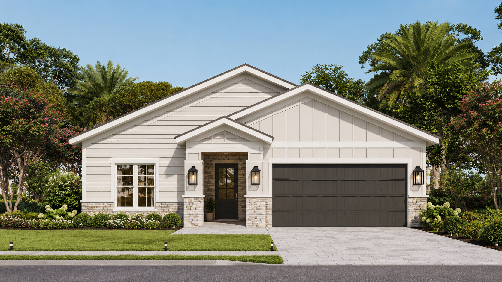 Modern white house with a gray garage door, black front door, and landscaped front yard with green lawn and flowering bushes, surrounded by trees, under a clear blue sky.