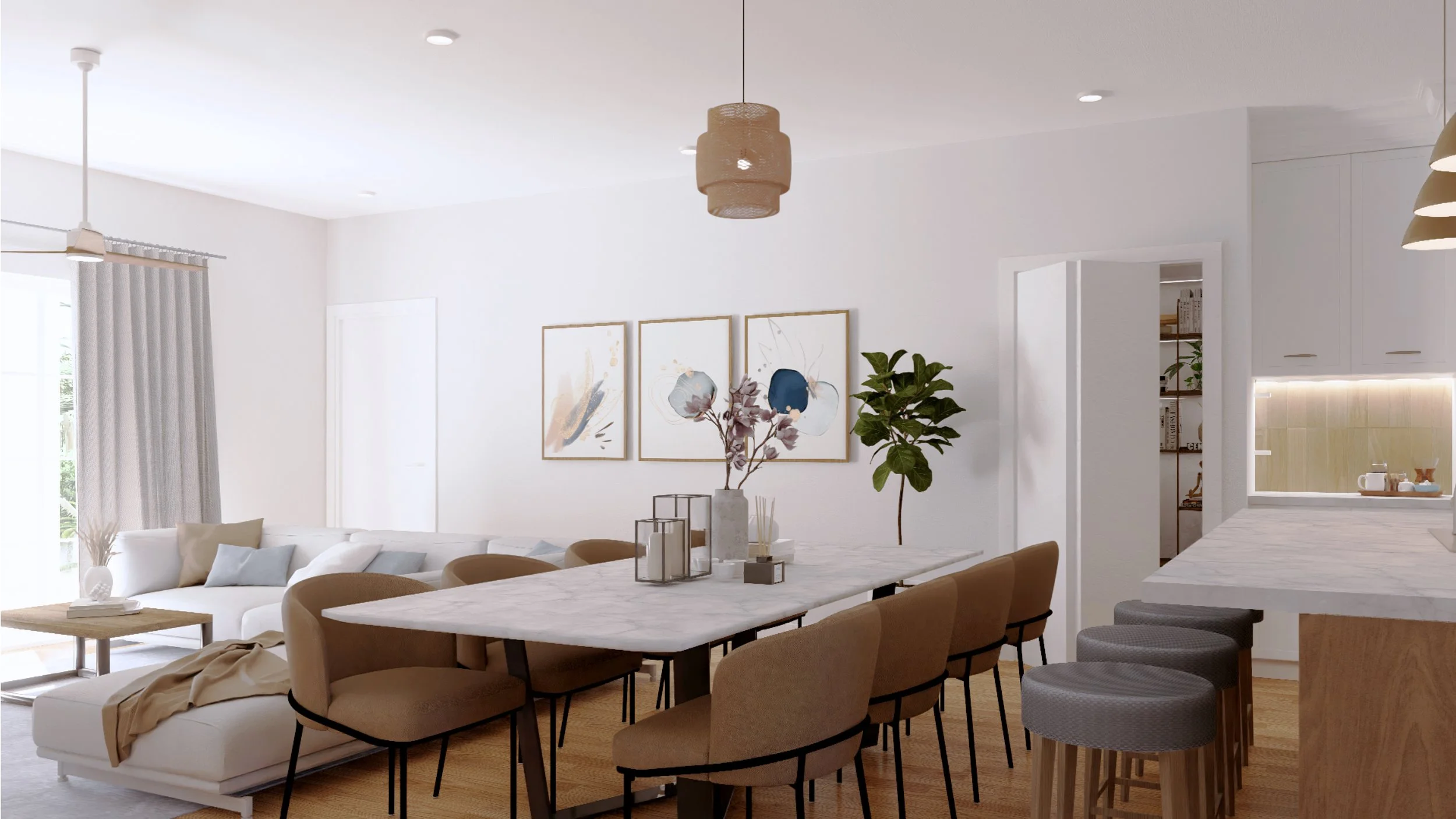 Open-concept living and dining area with white walls, wooden flooring, and modern furniture. There is a white sofa with pillows, a long white marble dining table with beige chairs, and a kitchen counter with gray stools. Decorative plants and framed 