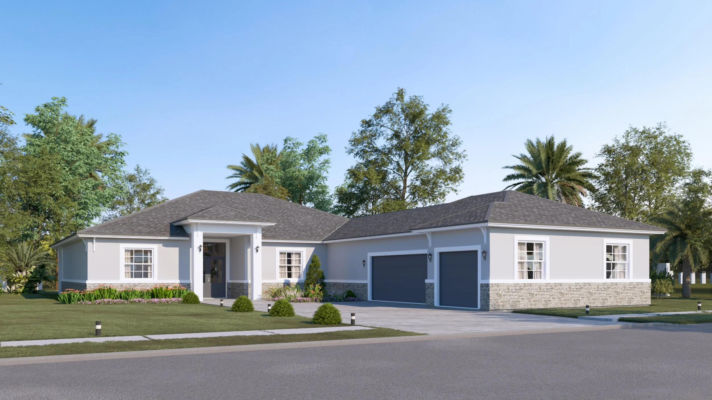 A modern single-story house with a gray roof, white walls, stone accents near the foundation, and a two-car garage. The front yard features a grassy lawn, small bushes, and flowering plants, with trees and a clear blue sky in the background.