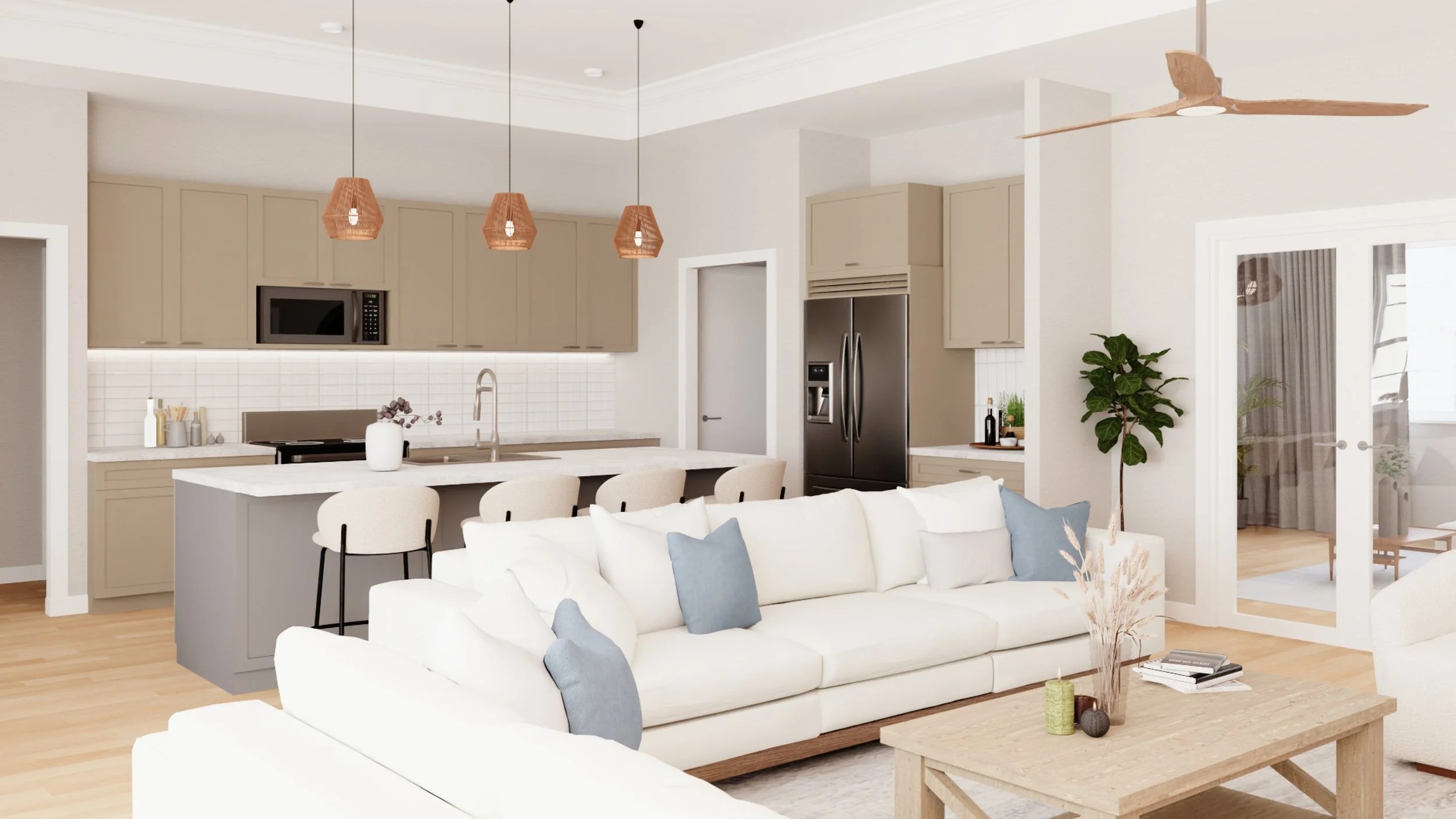 Modern open-concept living room and kitchen with beige cabinets, a white sofa with blue pillows, a wooden coffee table, pendant lights, a ceiling fan, and sliding glass doors.