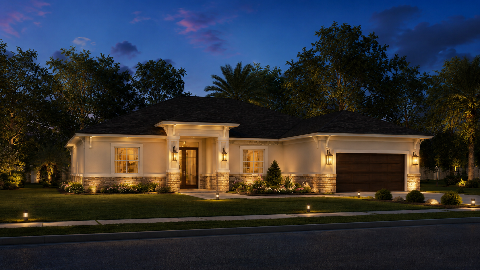 A modern house at dusk with exterior lights on, surrounded by trees, a well-manicured lawn, and a driveway with walkway lights.