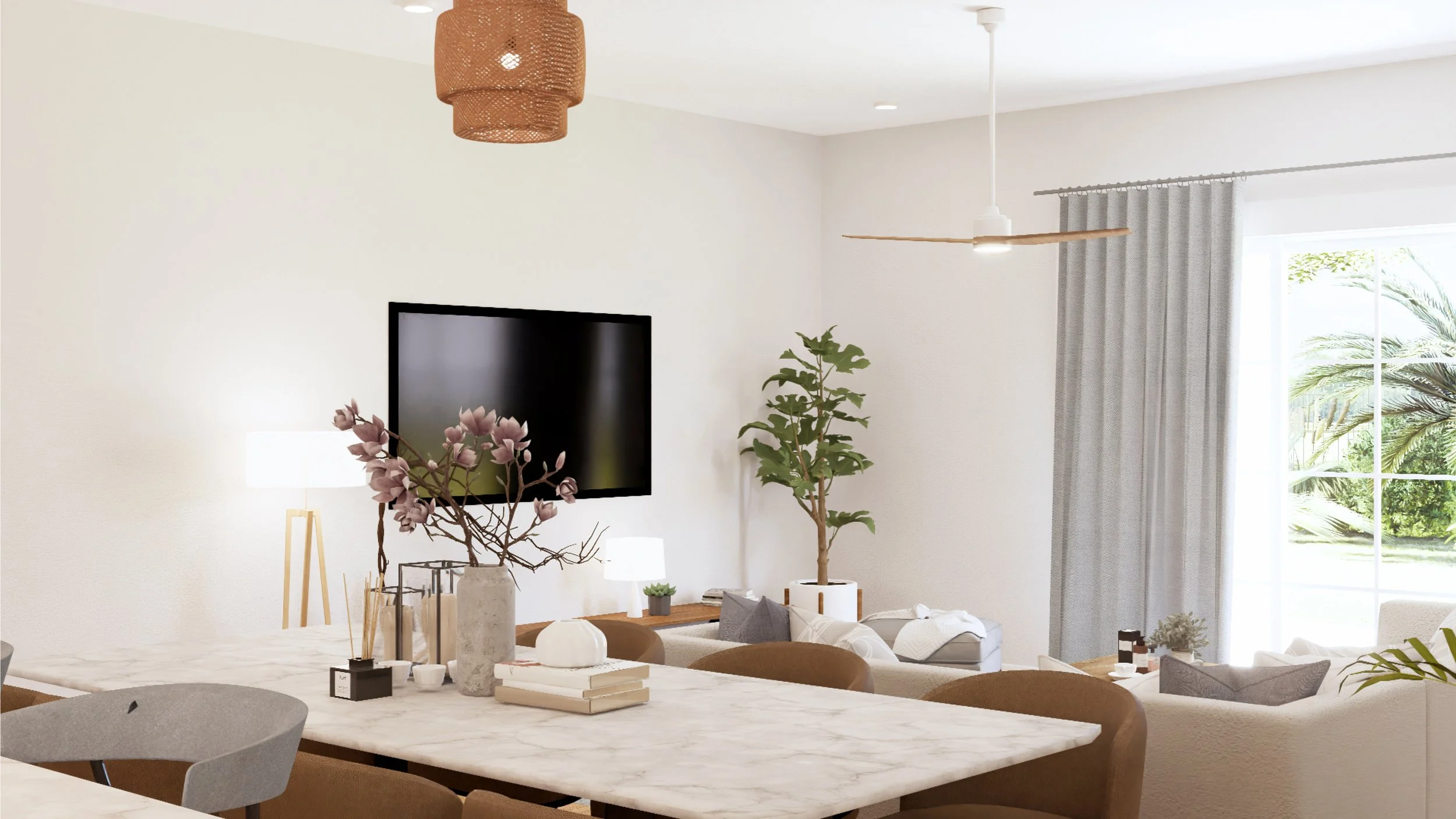Living room with white walls, a black flat-screen TV on the wall, and a ceiling fan with a white housing and wooden blades. There are curtains on a large window, some green plants, and a white couch with pillows. A dining table with a marble surface 