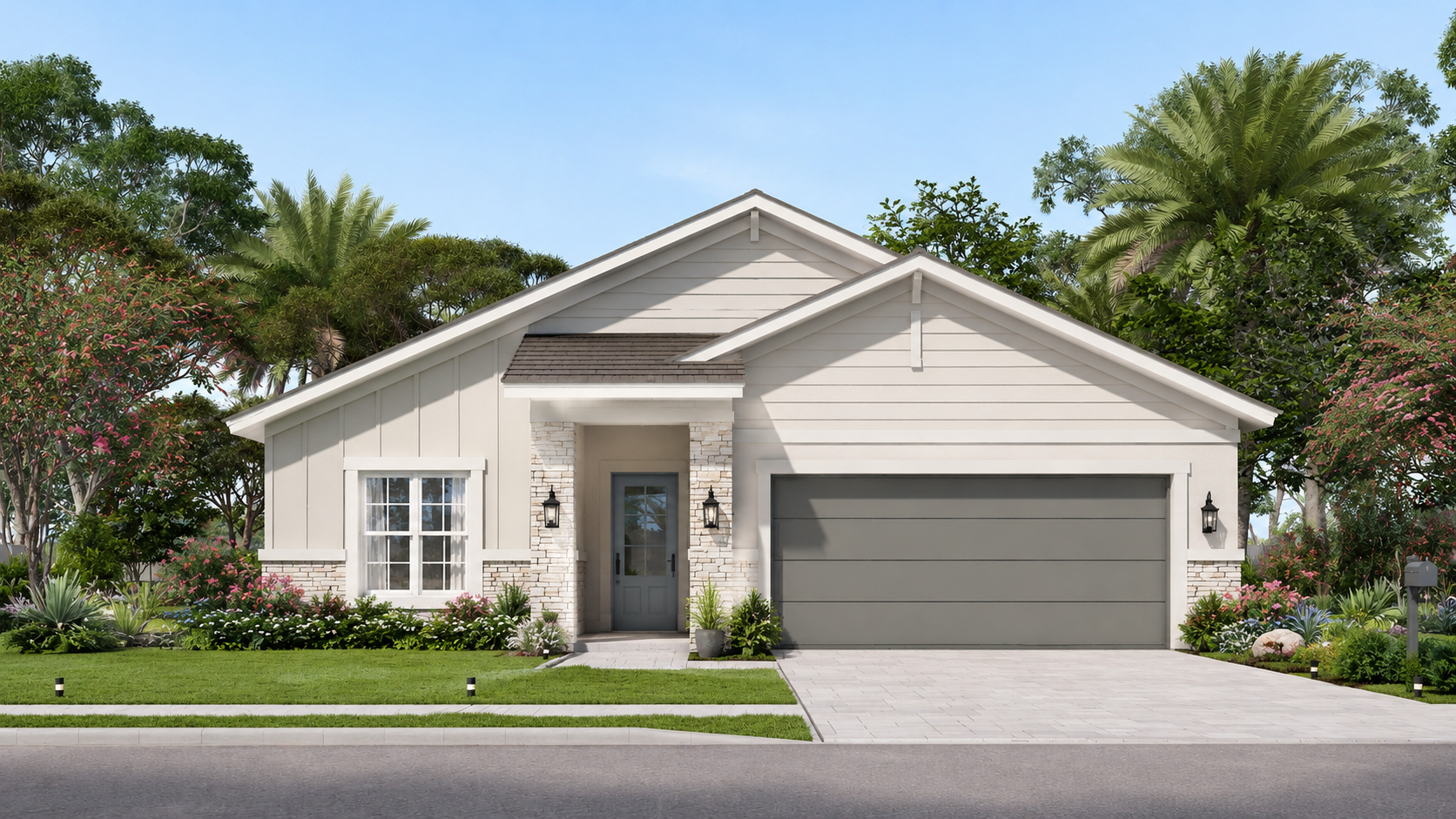 A modern single-story house with a light gray exterior, blue garage door, and a dark blue front door. The house has a pitched roof with gray shingles, and is surrounded by a green lawn, flowering plants, and tall trees under a clear blue sky.