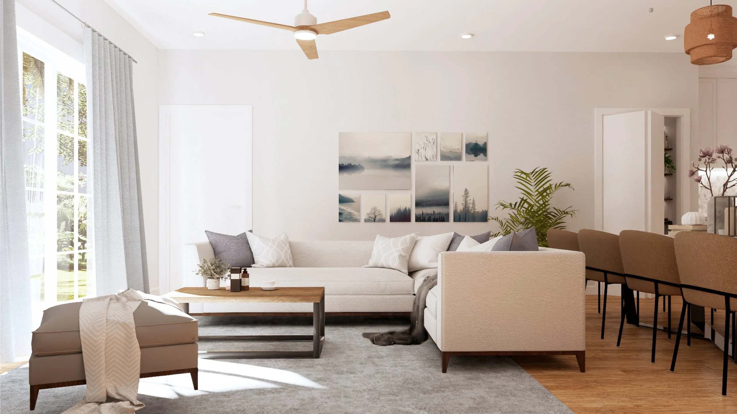 Bright and airy living room with white walls, large window with curtains, beige sectional sofa with pillows, wooden coffee table with decor, beige ottoman with a throw, artwork on the wall, indoor plant, and bar stools at a kitchen island.