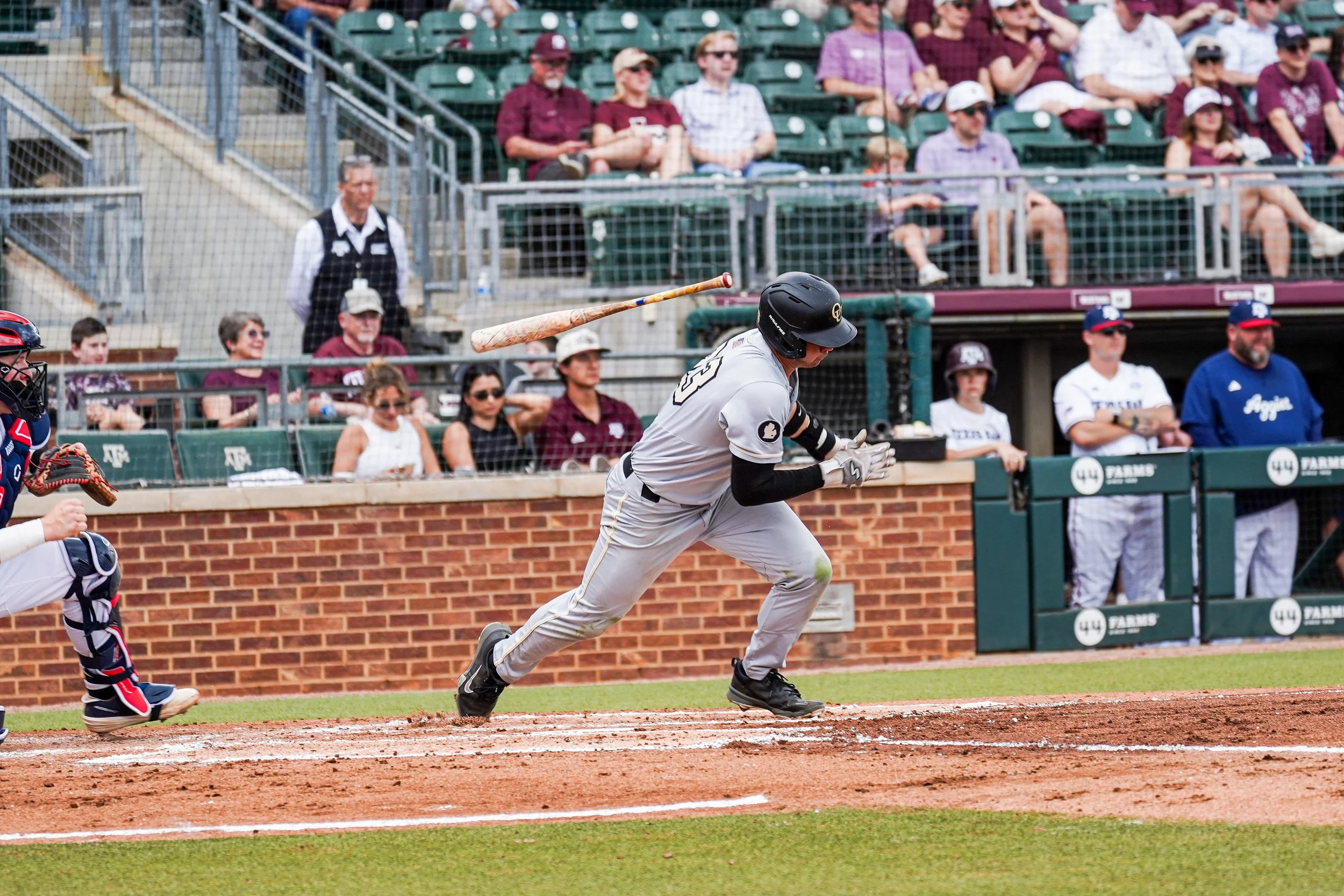Sophomore Tony Konopiots throws the bat over his shoulder while running to first base against No. 22 Texas A + M on Saturday, March 7, 2026.