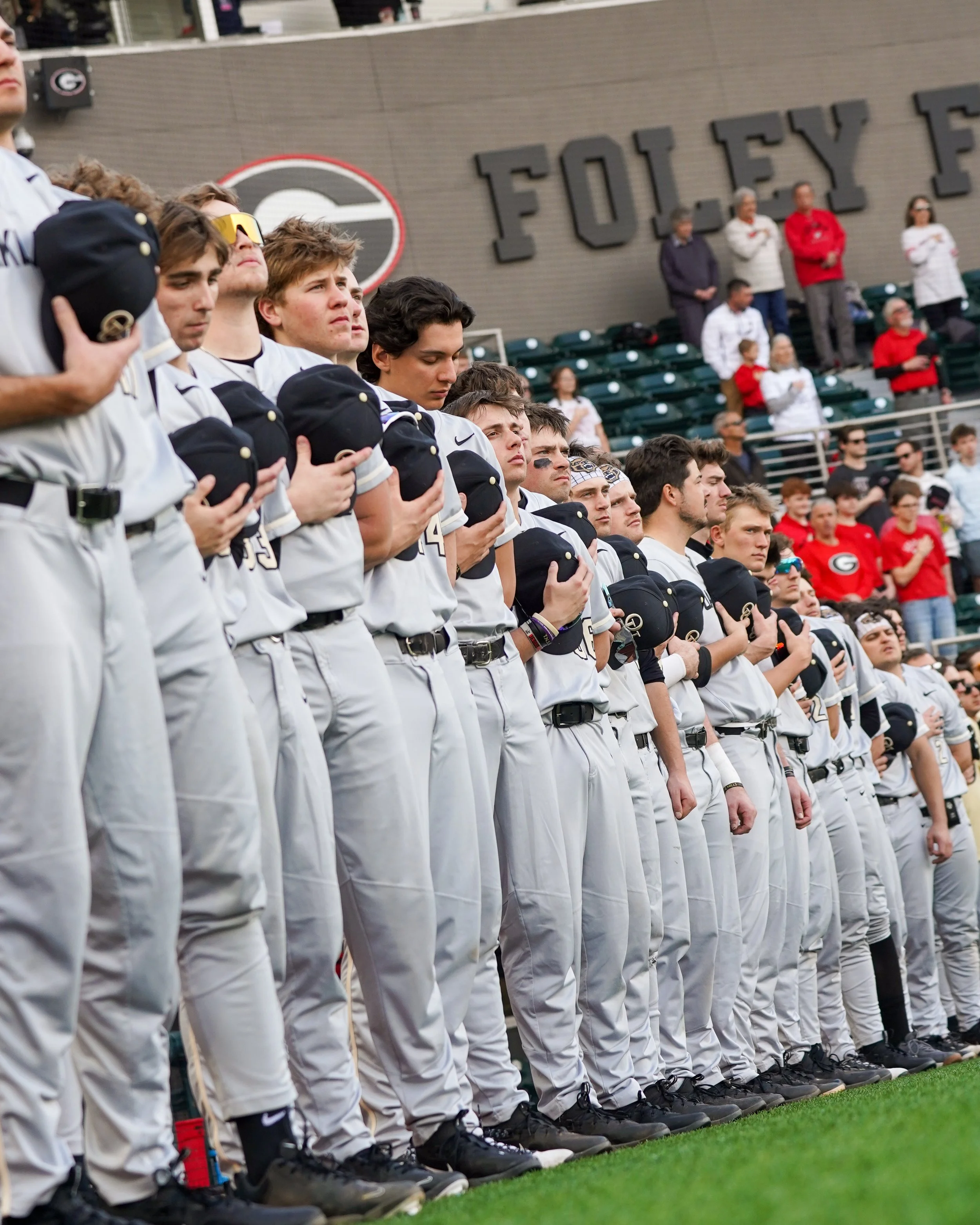 The Golden Grizzlies stand for the National Anthem before playing Georgia on February 27, 2026. Players close their eyes during the National Anthem as they prepare for the game ahead.