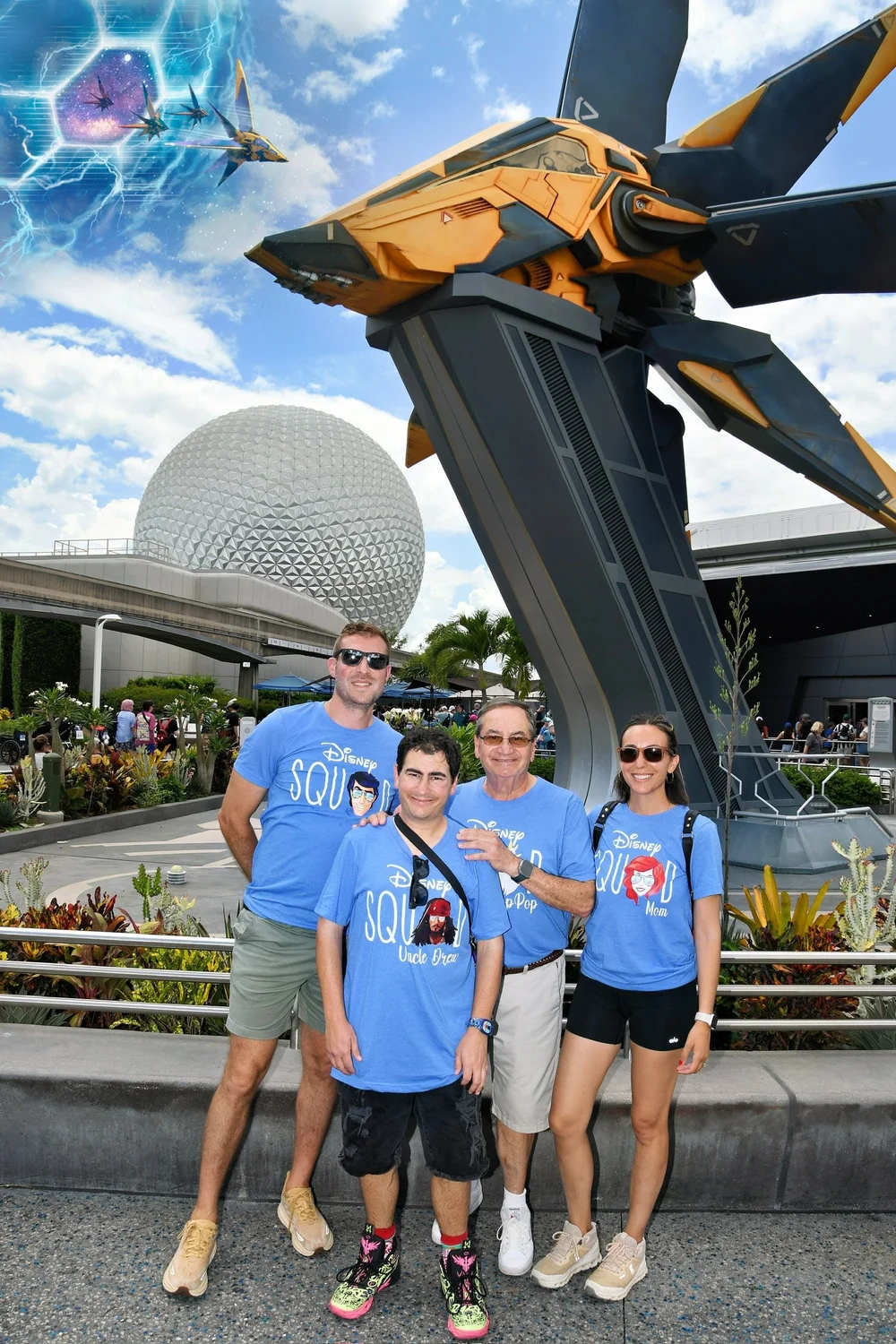 Family at epcot standing in front of the Avengers ride