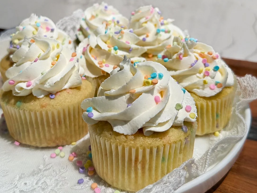 Funfetti cupcakes on white plate