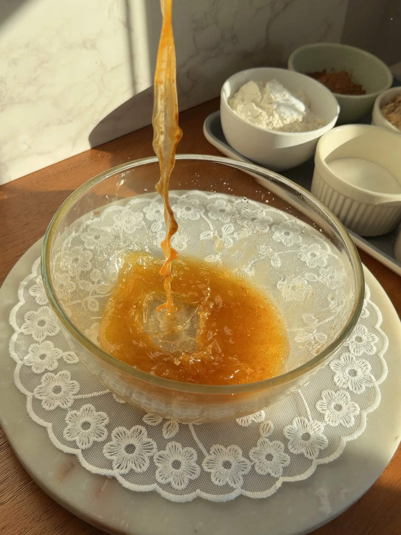browned butter being poured into mixing bowl