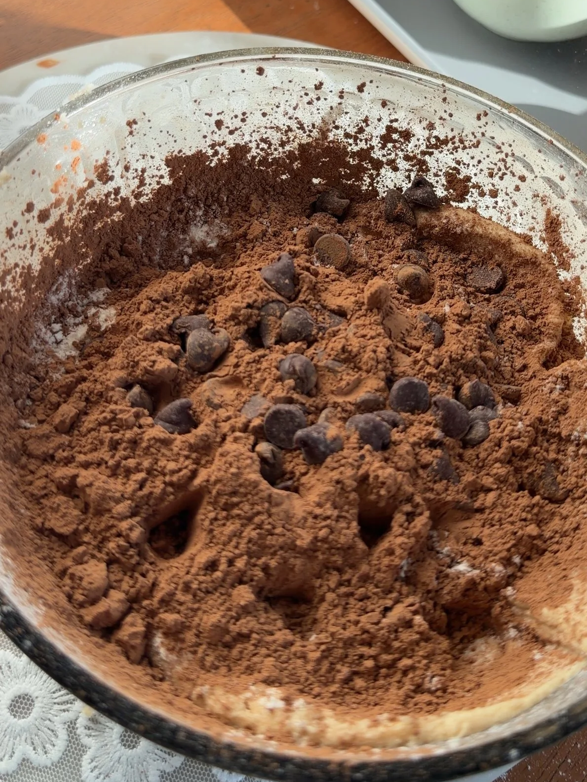 cocoa powder and chocolate chips added to mixing bowl. 
